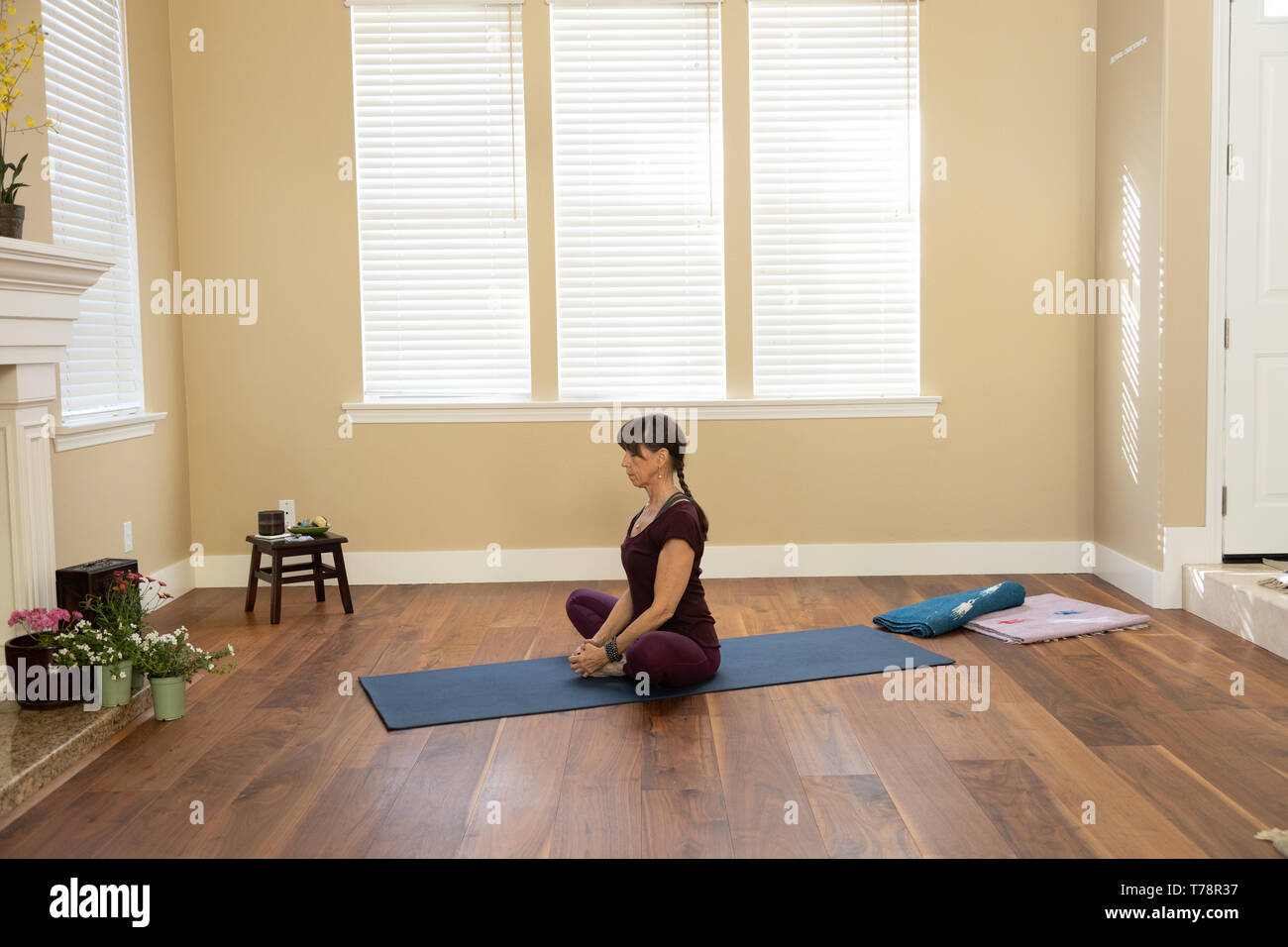 Yoga pose Butterfly Stretch Cobbler's Pose Stock Photo