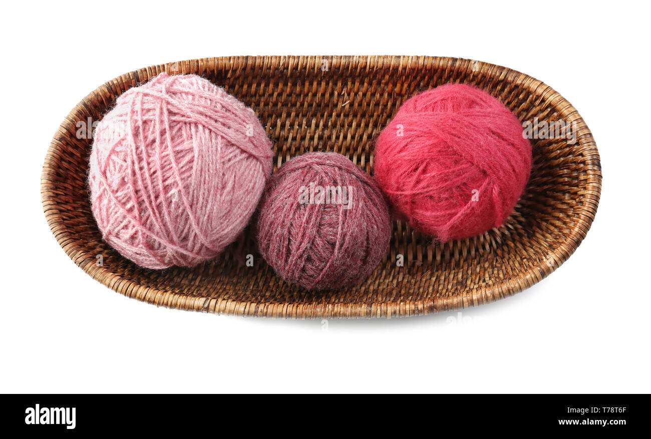 Wicker basket with balls of knitting yarn on white background Stock ...