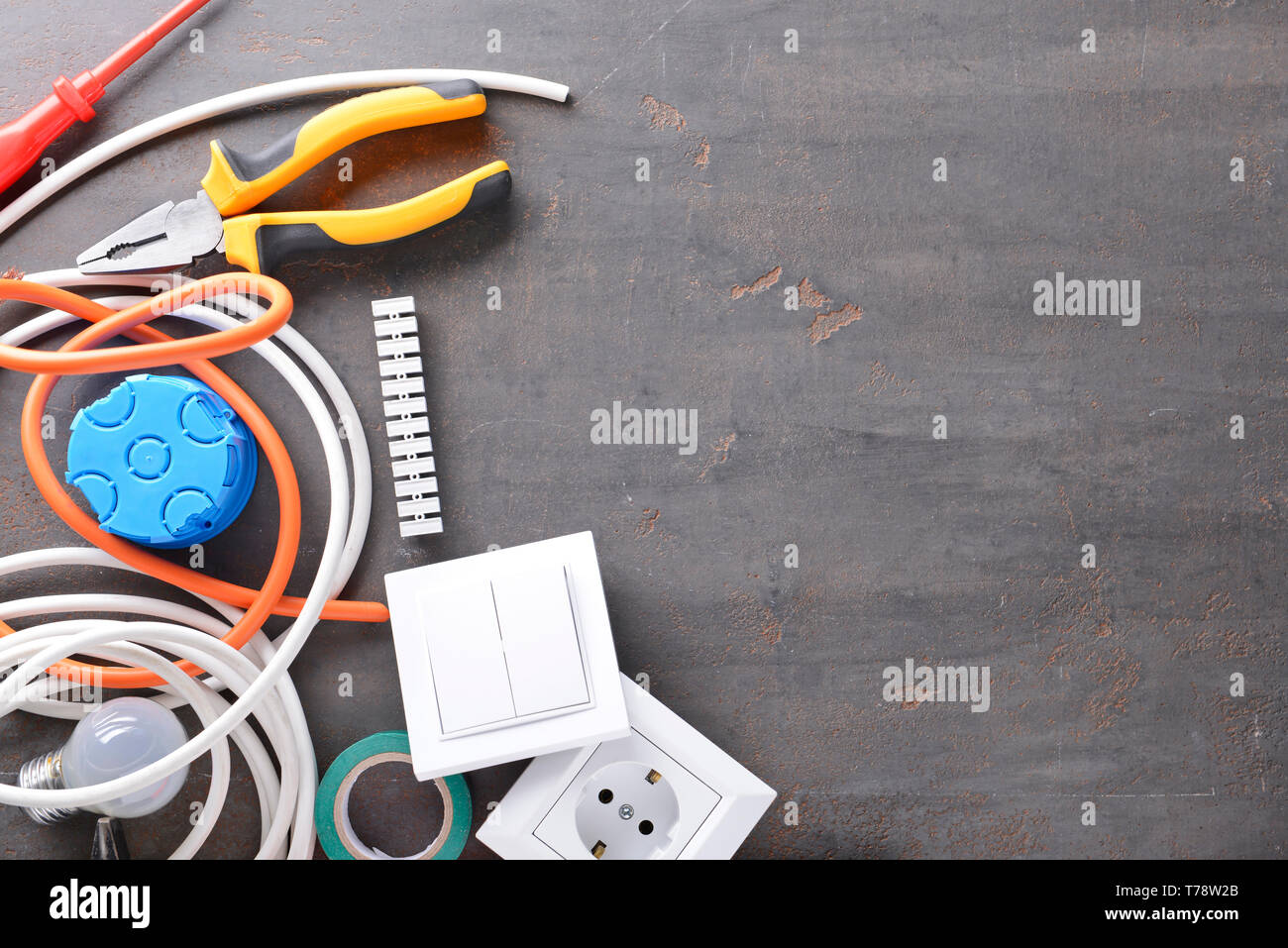 Electrician's supplies on grey background Stock Photo
