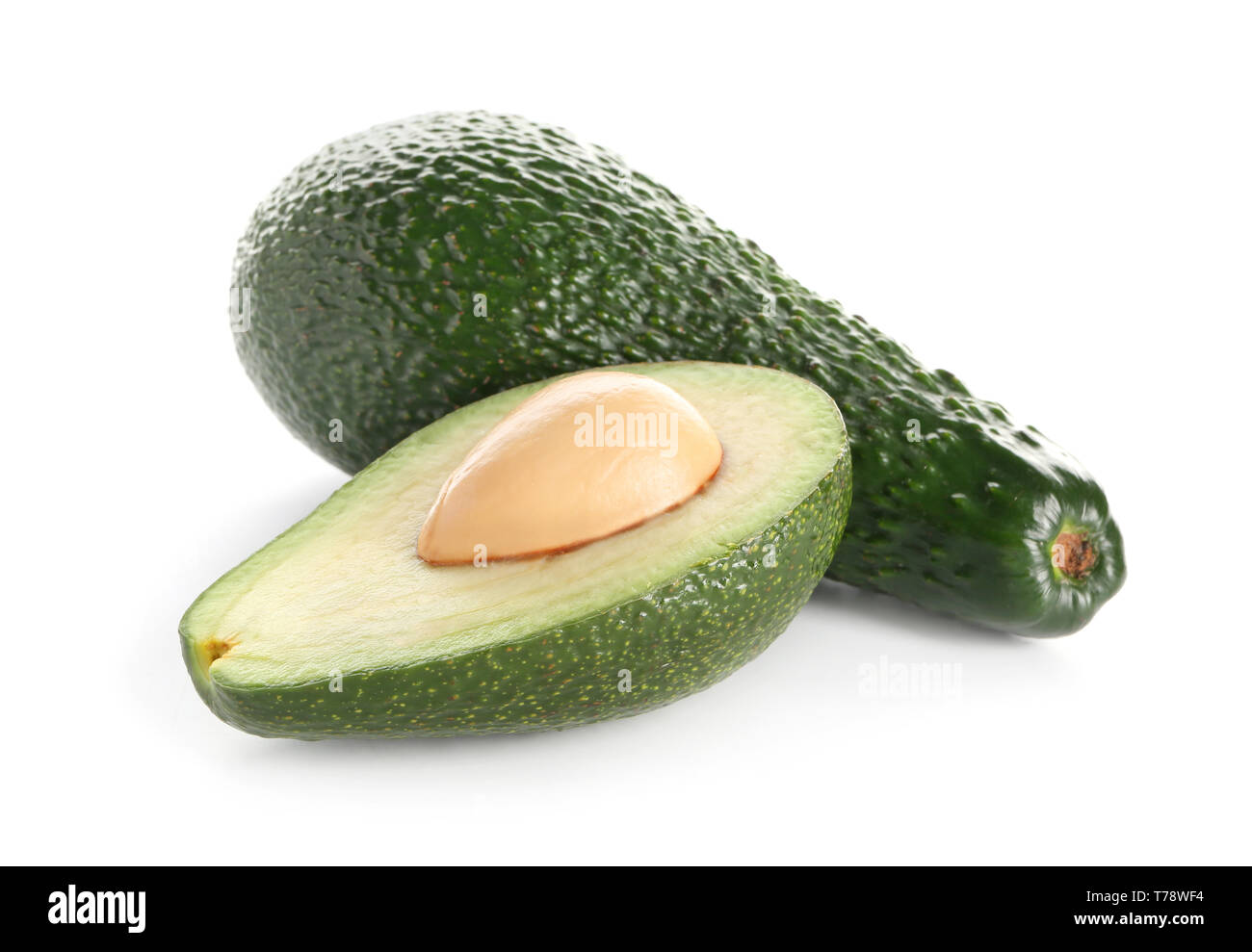 Ripe avocados on white background Stock Photo - Alamy