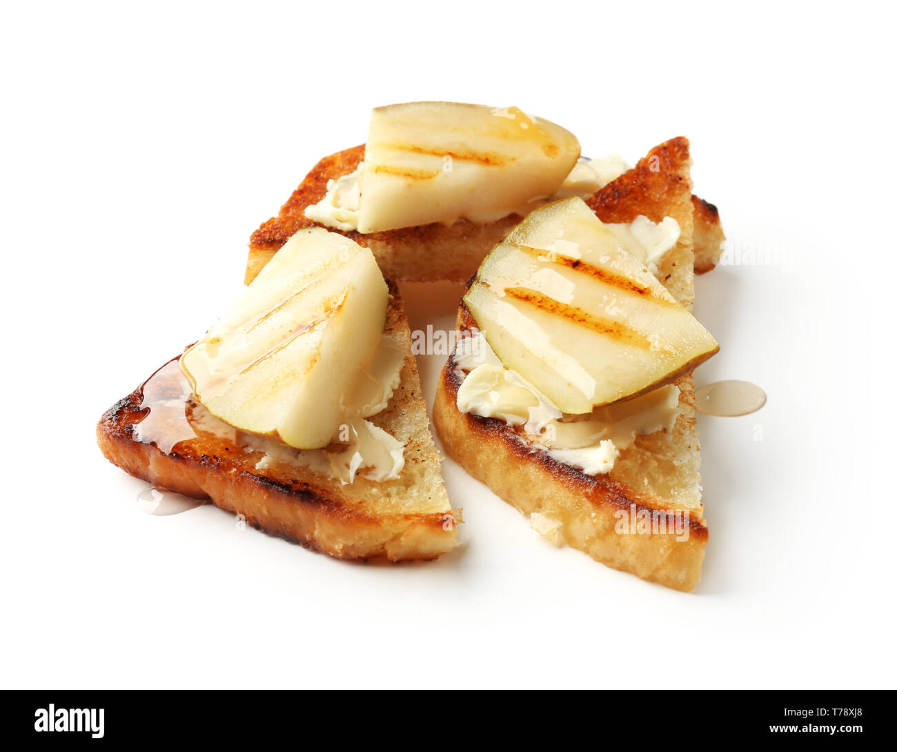 Delicious toasts with pear, butter and honey on white background Stock ...