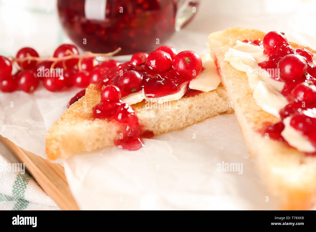Red Toasts Delicious toasts with red currant on wooden board Stock Photo - Alamy