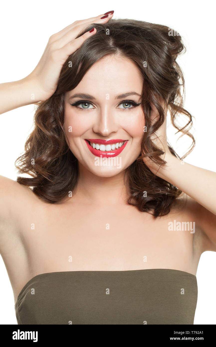 Smiling woman with perfect curly hair. Cheerful model girl portrait Stock Photo