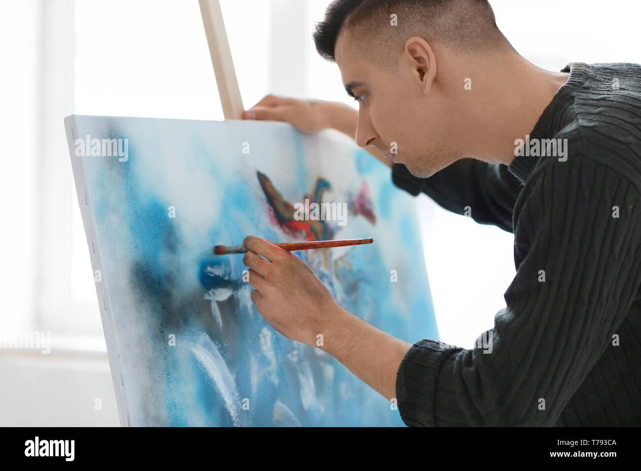 Young man paints abstract art hi-res stock photography and images - Alamy