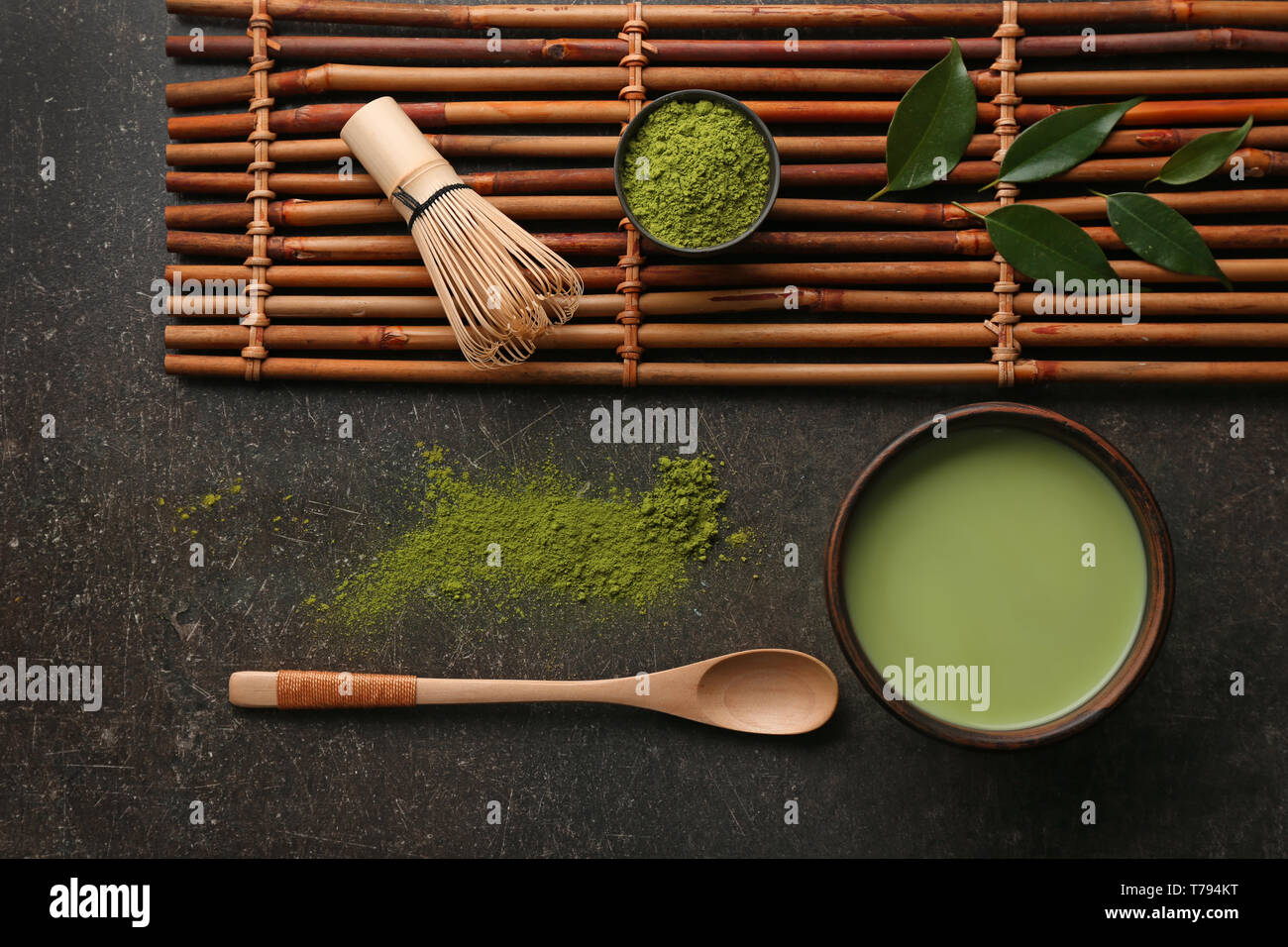 Composition with powdered matcha tea on dark grey background Stock Photo