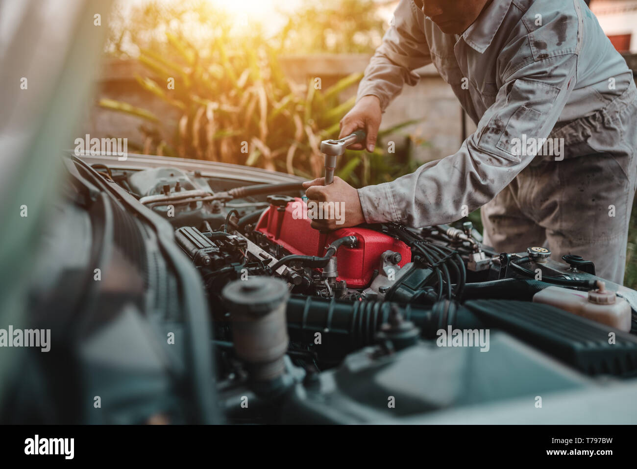 The technician mechanic checking engine and repair Stock Photo