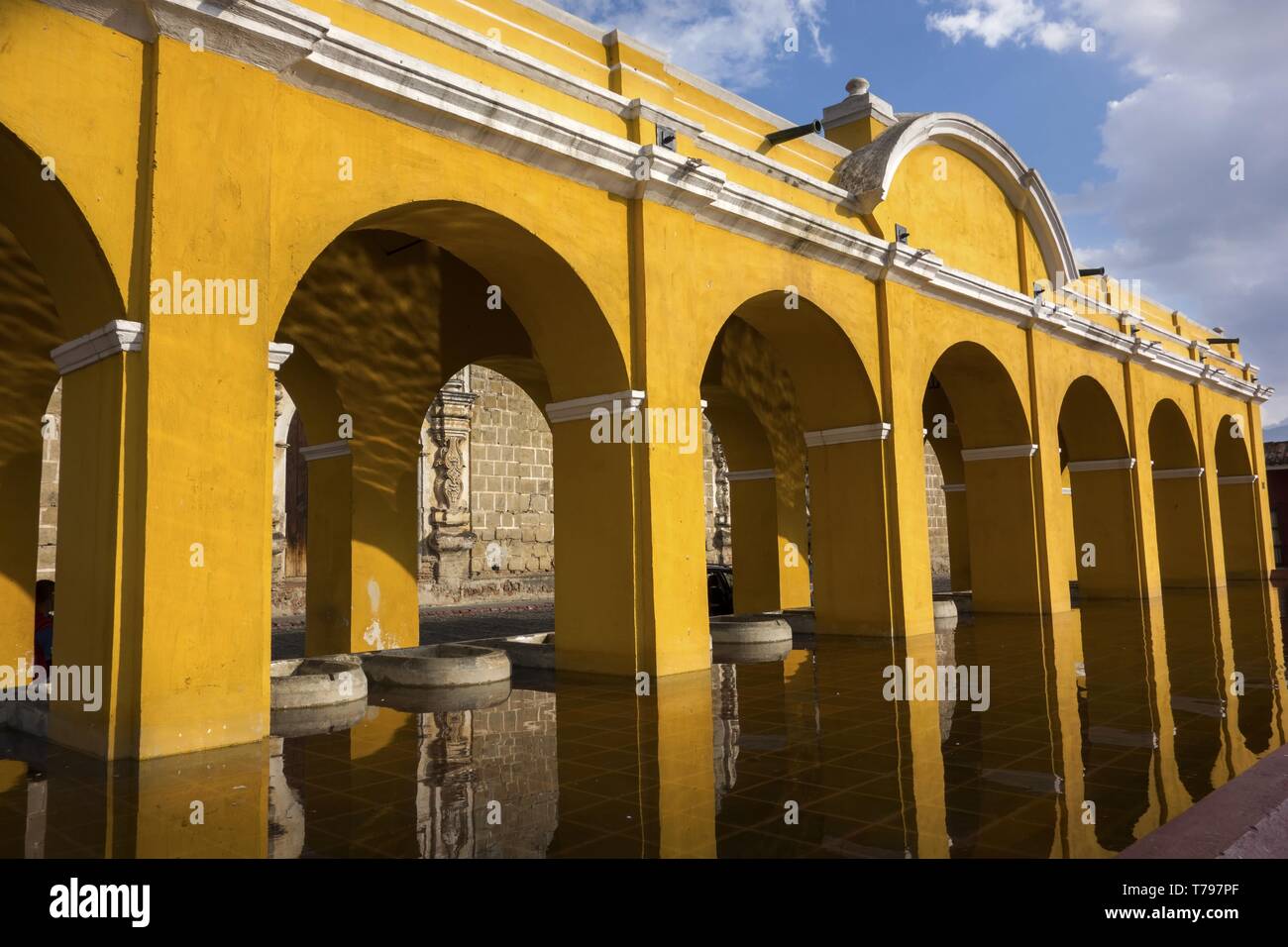 Public Laundry Fountain, Tanque lavadero el Parque la Union, with Spanish Colonial Architecture Yellow Arches in Old City Antigua Guatemala Stock Photo
