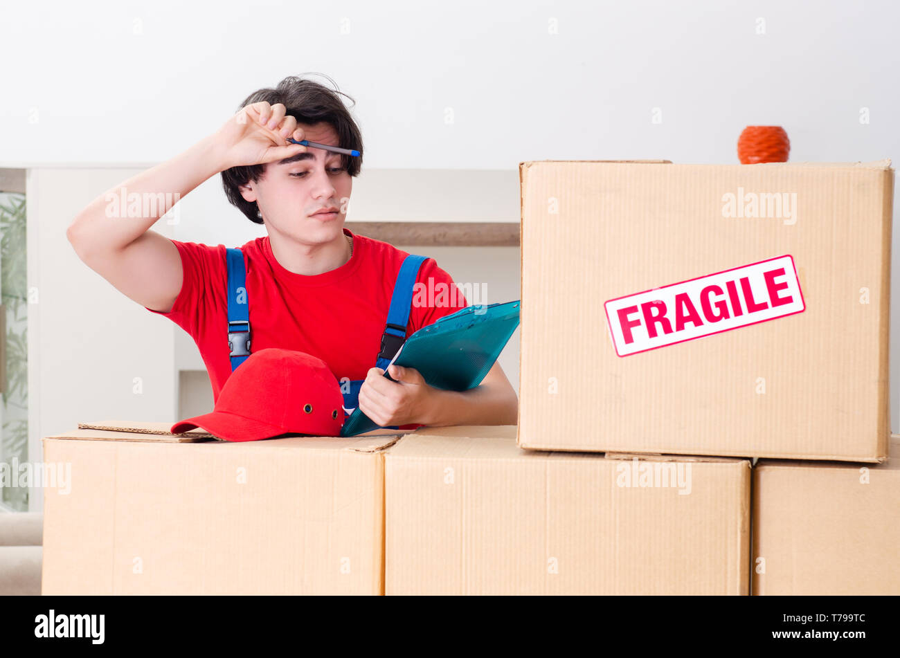 Young male contractor boxes hi-res stock photography and images - Alamy