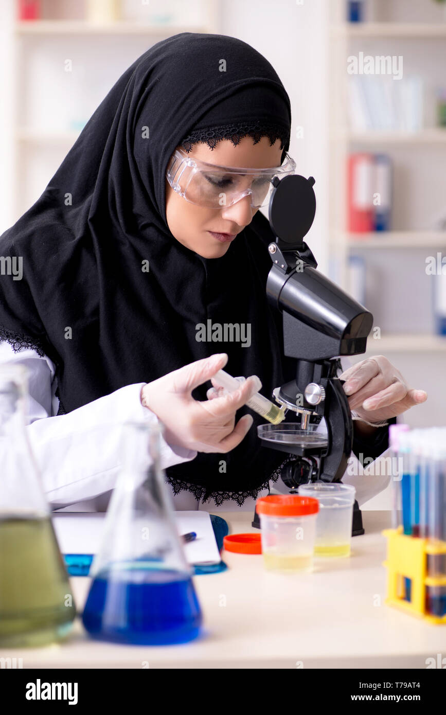 Female chemist in hijab working in the lab Stock Photo - Alamy