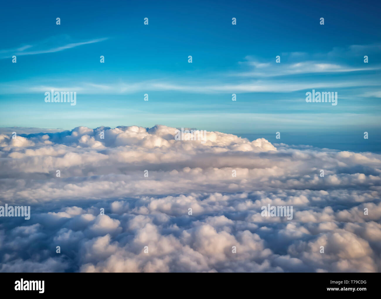 Aerial view of monsoon clouds over the plains of India. Thick layers of Cumulonimbus and Cumulus clouds are visible in the frame. Stock Photo