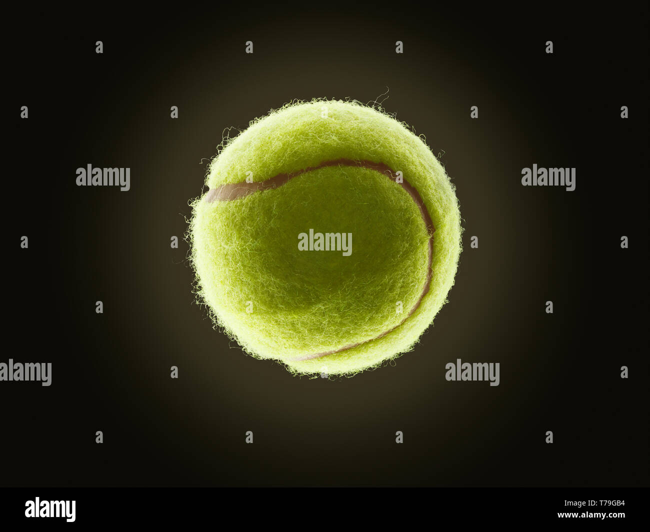 single tennis ball with eclipse like effect on a dark background Stock Photo