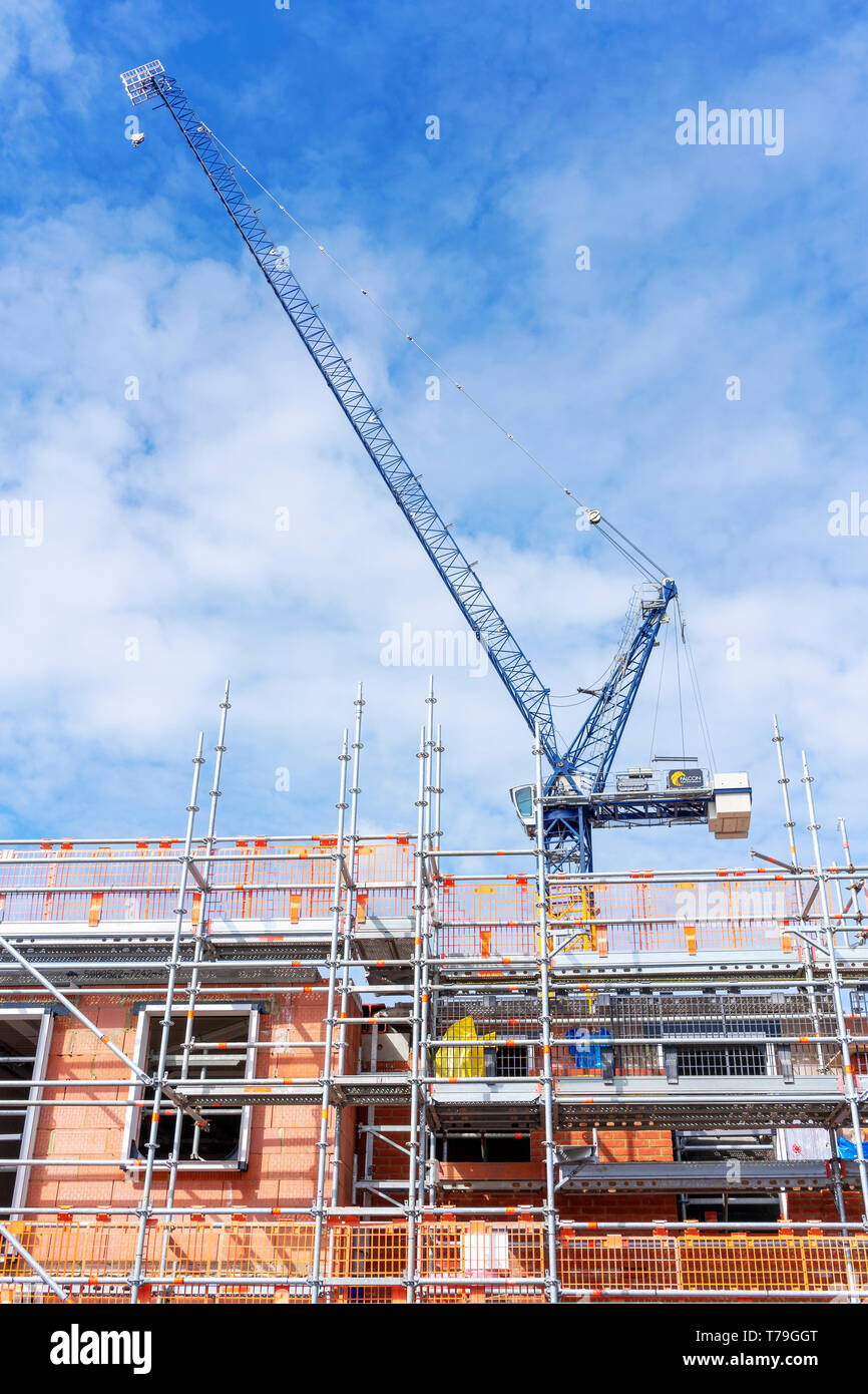 Construction site with scaffolding and crane Stock Photo - Alamy