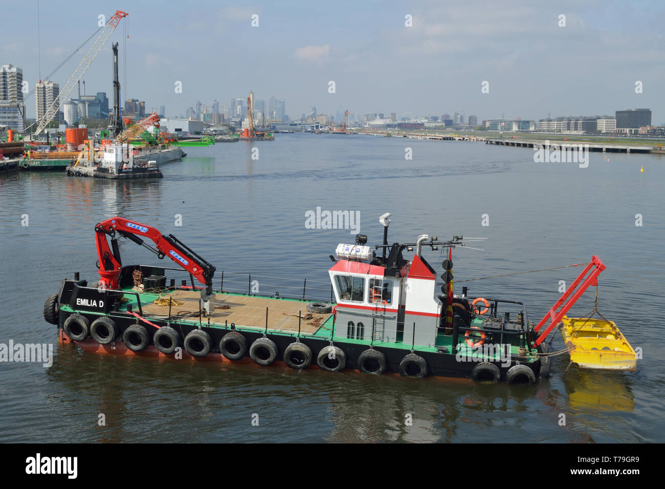 Multicat Emilia D undertaking dredging work in the King George V Dock, London, as part of the London City Airport CADP development programme Stock Photo