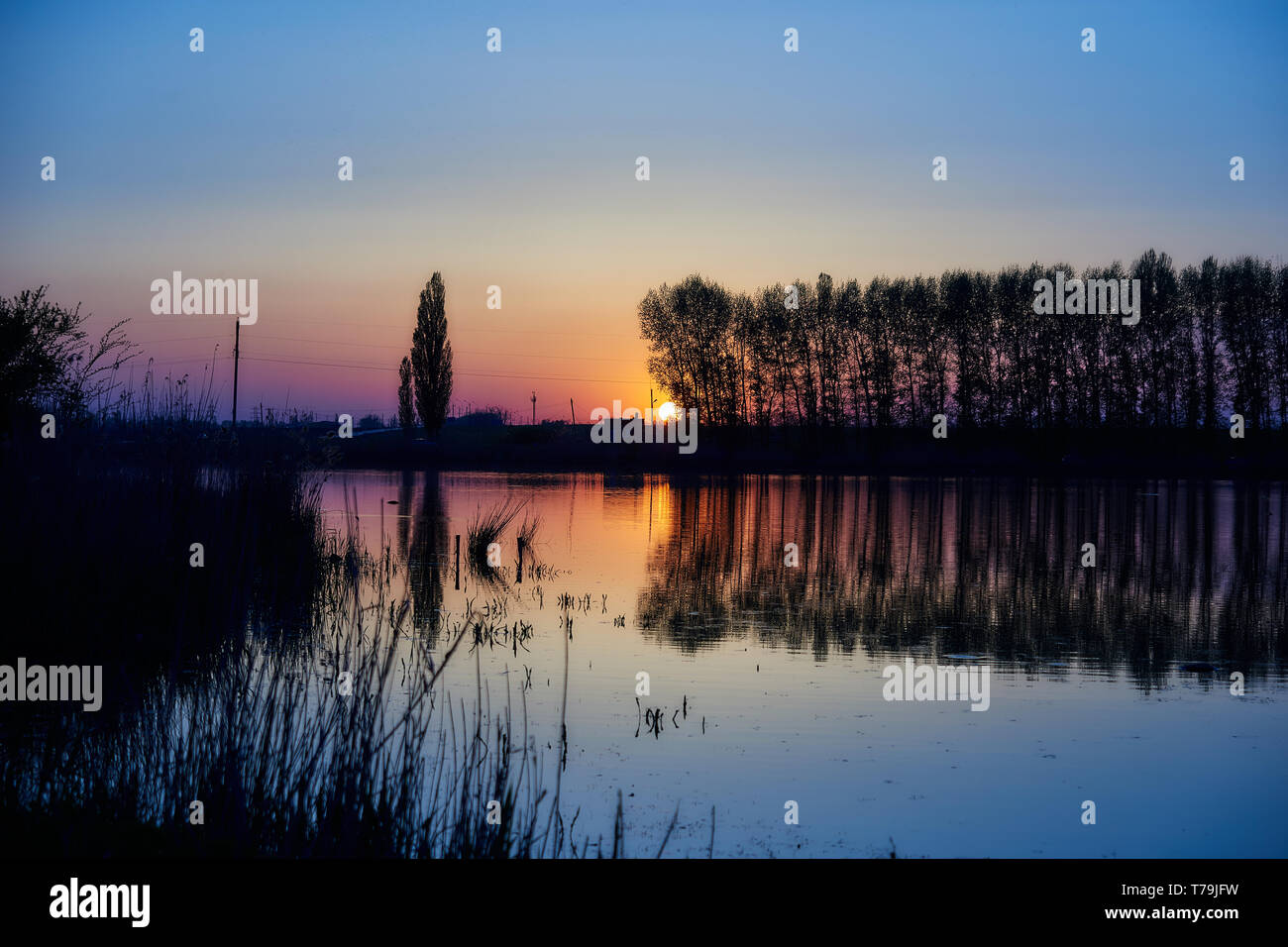 Colorful dawn sky reflected in hi-res stock photography and images - Alamy