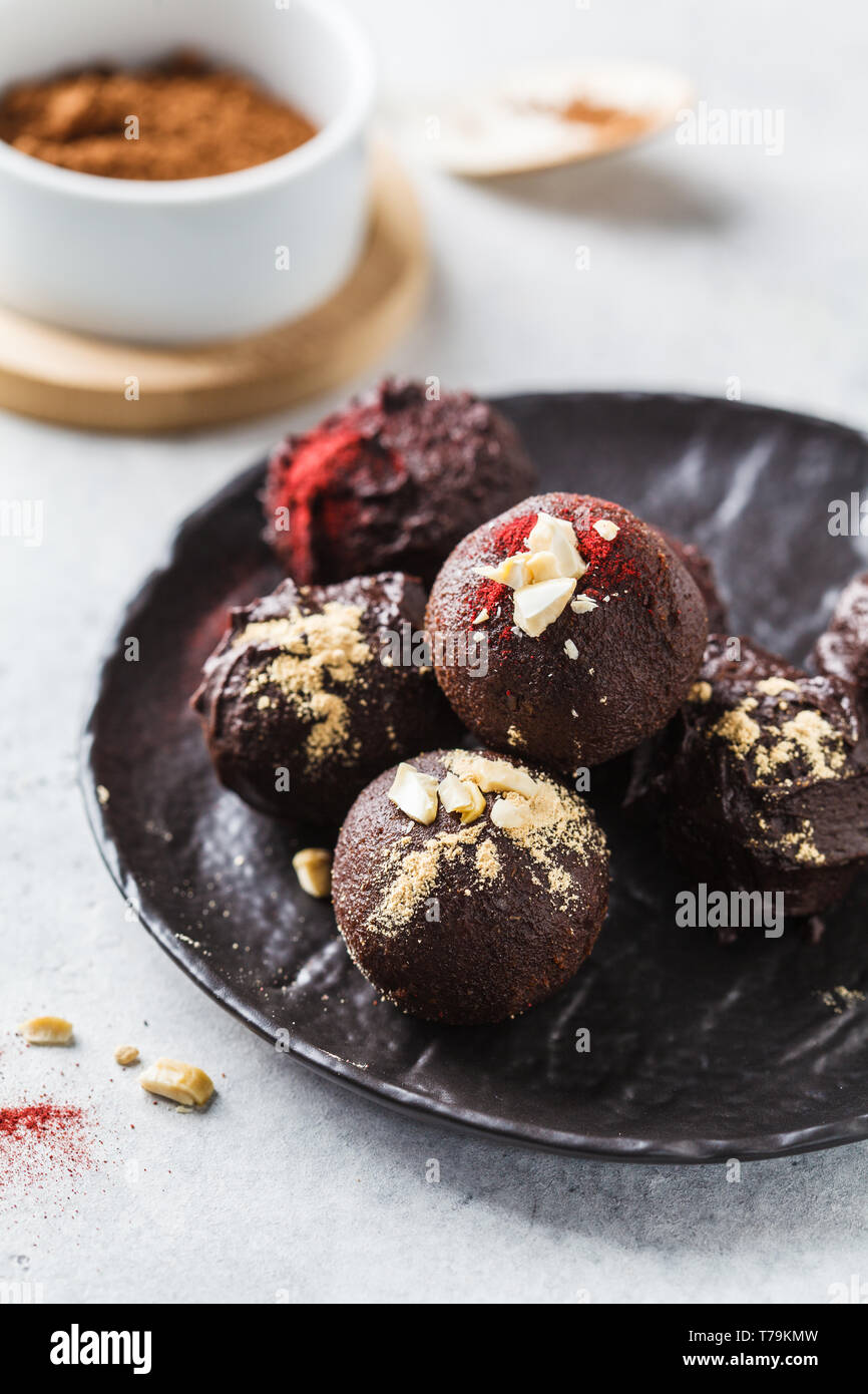 Healthy raw vegan energy balls with cocoa, dates, maca, chia on white background Stock Photo Alamy