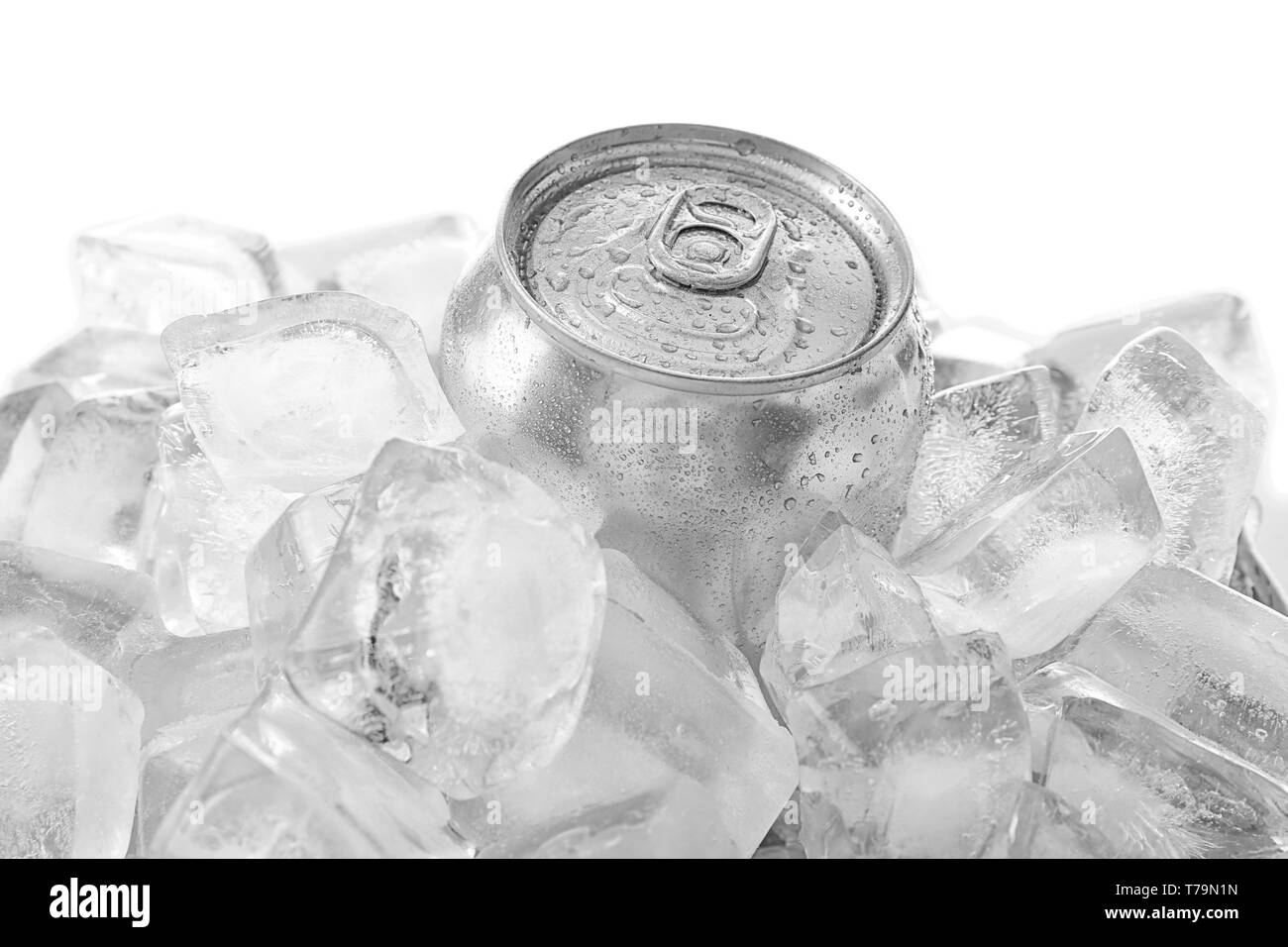 Can of beer in ice on white background Stock Photo - Alamy