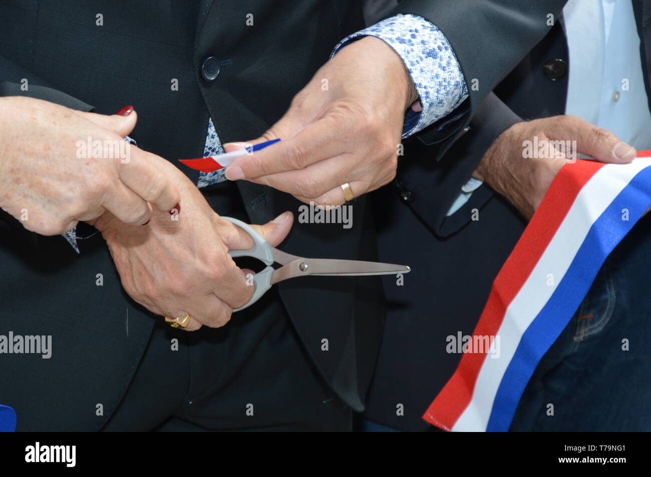 French ribbon ( Inauguration ) cut with a pair of scissors Stock Photo