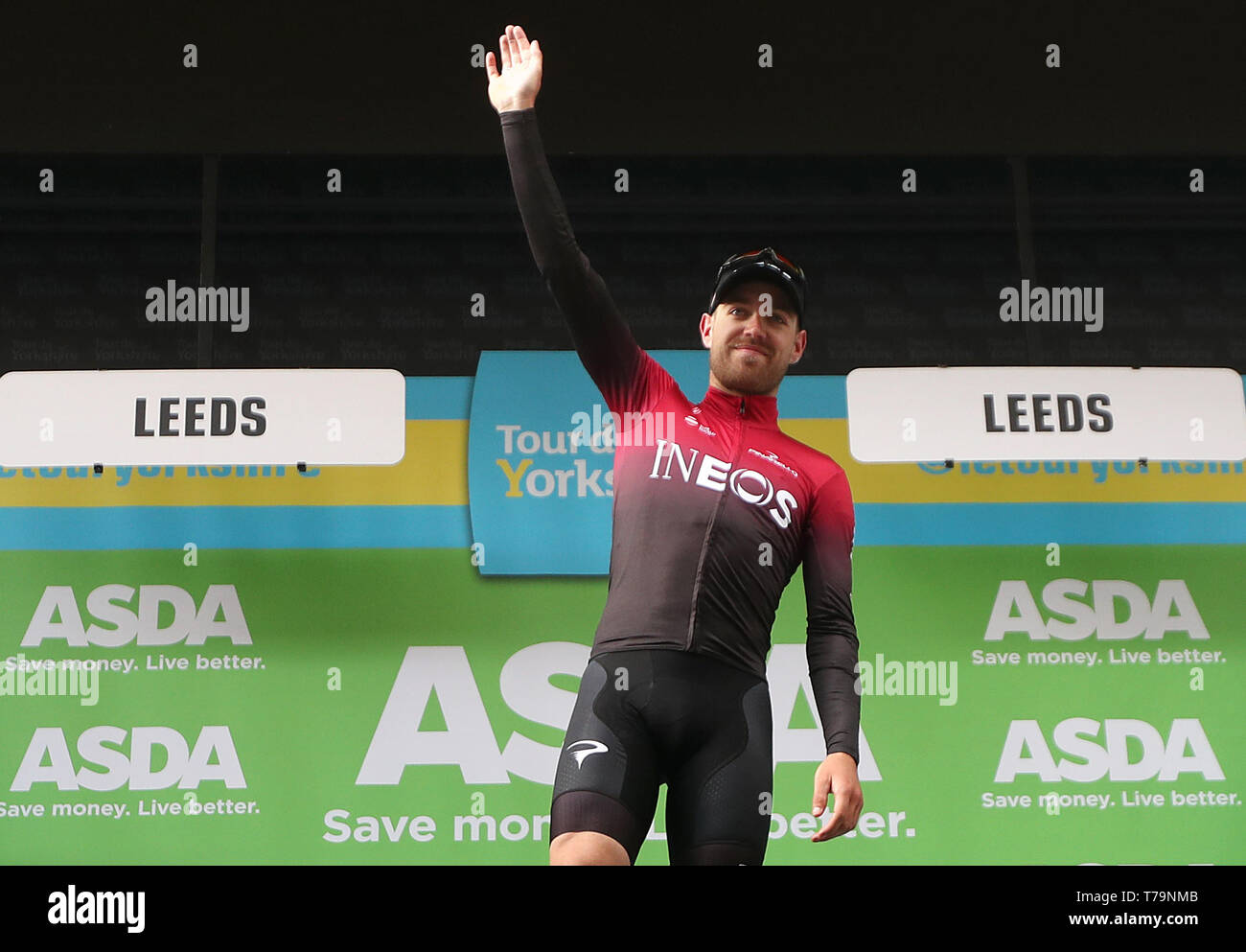 Team Ineos' Chris Lawless takes the podium after winning best ...