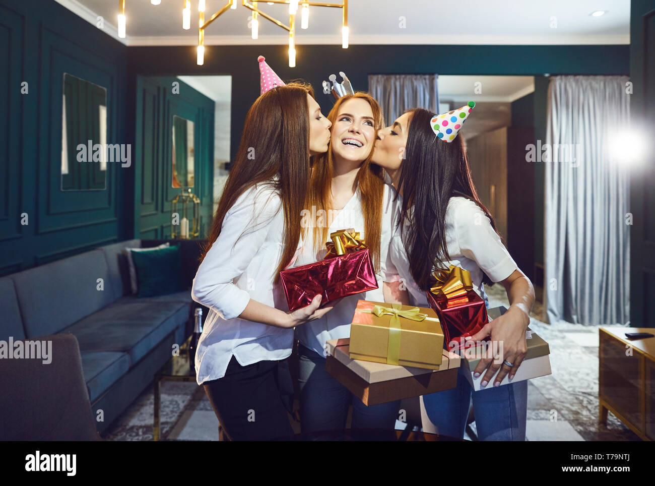 Girls friend congratulate gifts for a birthday party Stock Photo