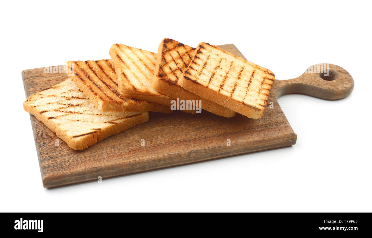 Wooden board with toasted bread on white background Stock Photo - Alamy