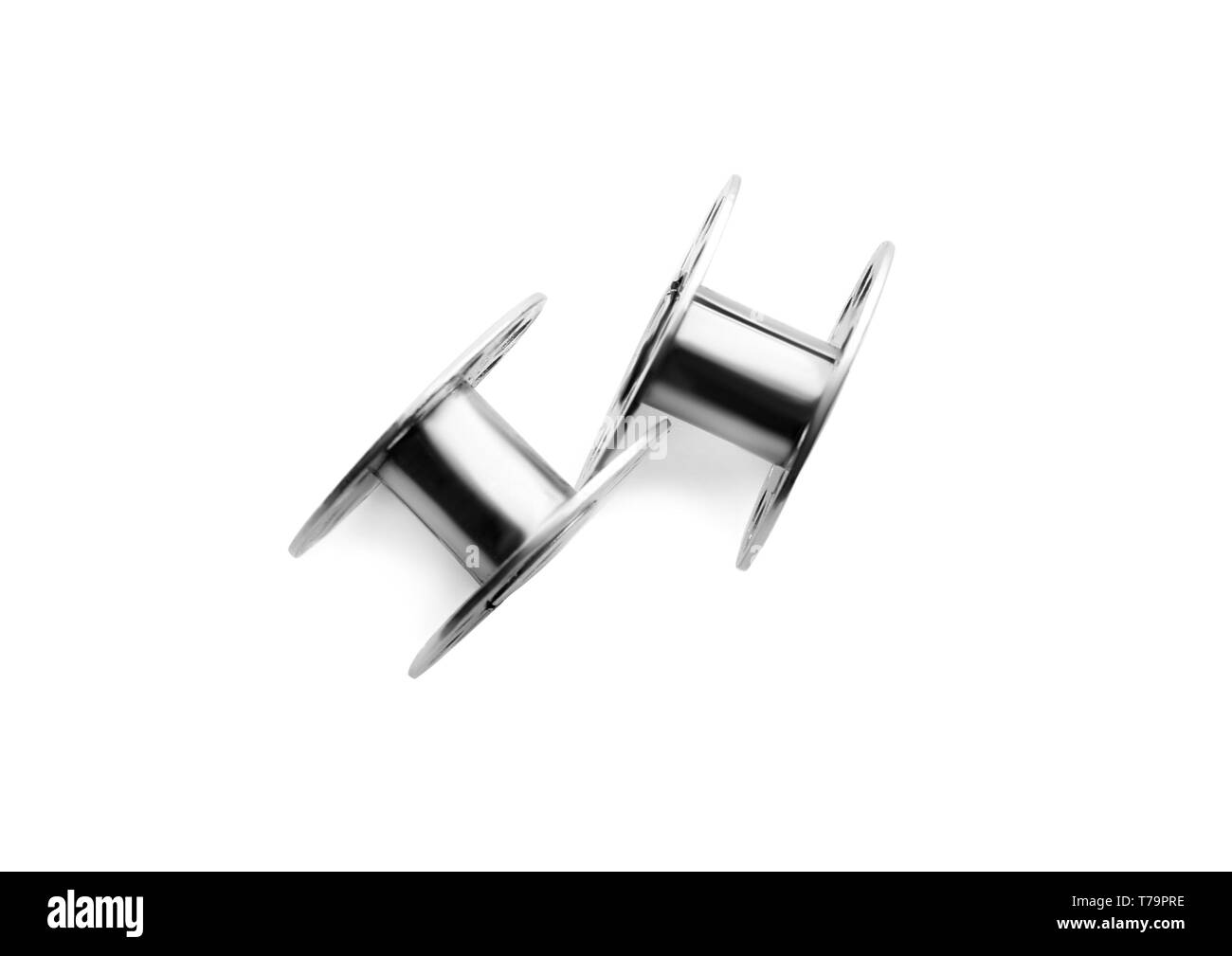 Metal spools for thread on white background Stock Photo - Alamy