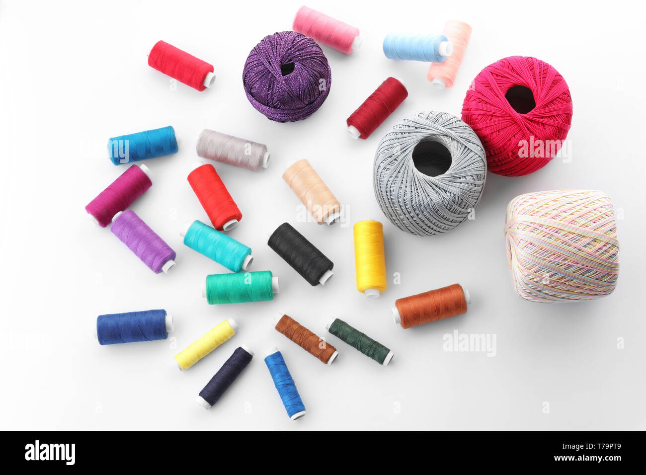 Set of sewing and knitting threads on white background Stock Photo - Alamy