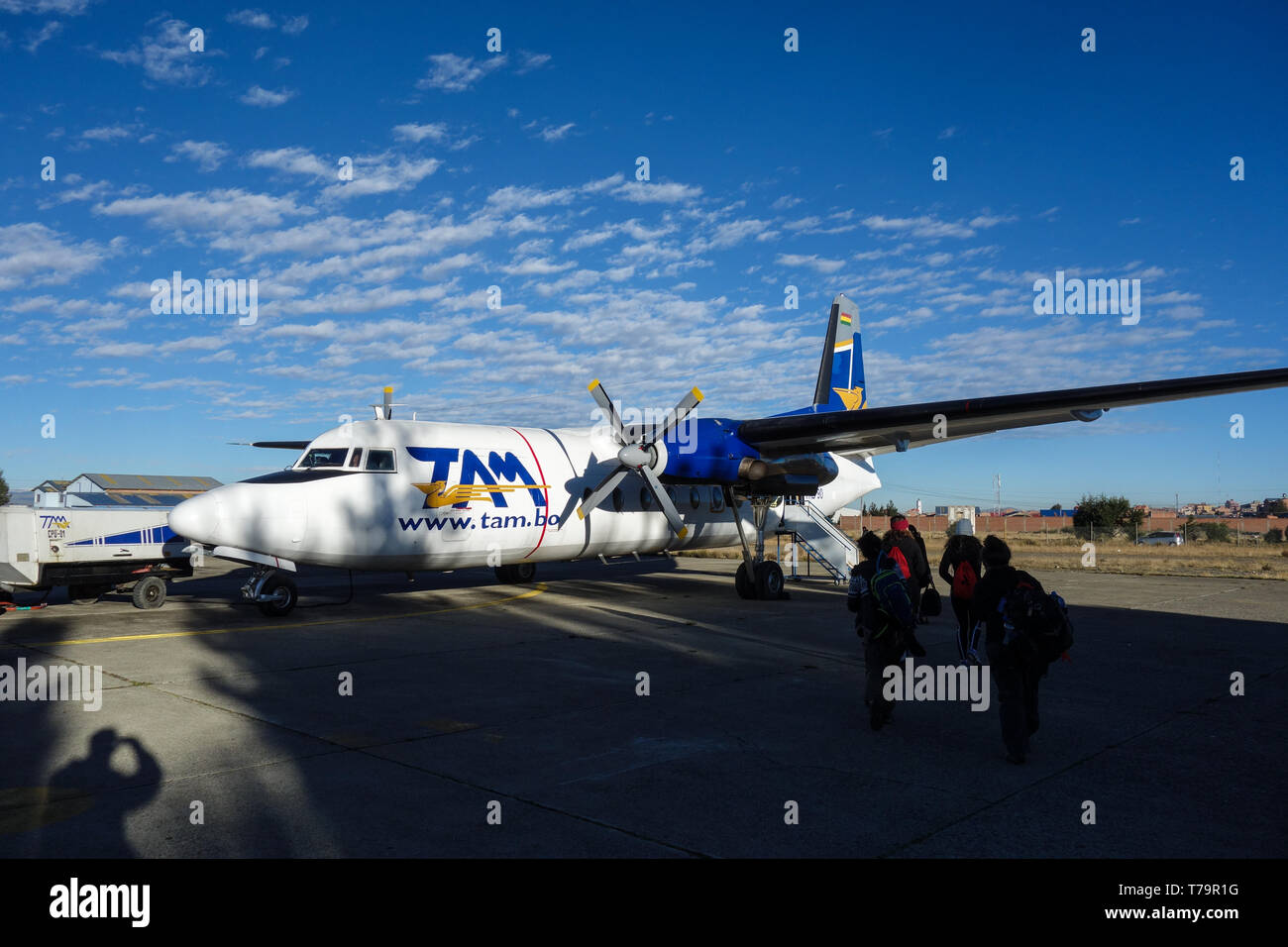 La Paz - military airport, Bolivia - May 31, 2017: An old TAM propeller airplane, boarding backpacker before departure to Rurrenabaque, Bolivia Stock Photo