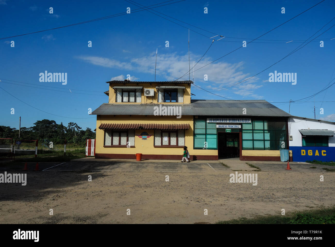 Airport Rurrenabaque, Bolivia - June 04, 2017: Front of the passenger terminal, two local kids playing Stock Photo