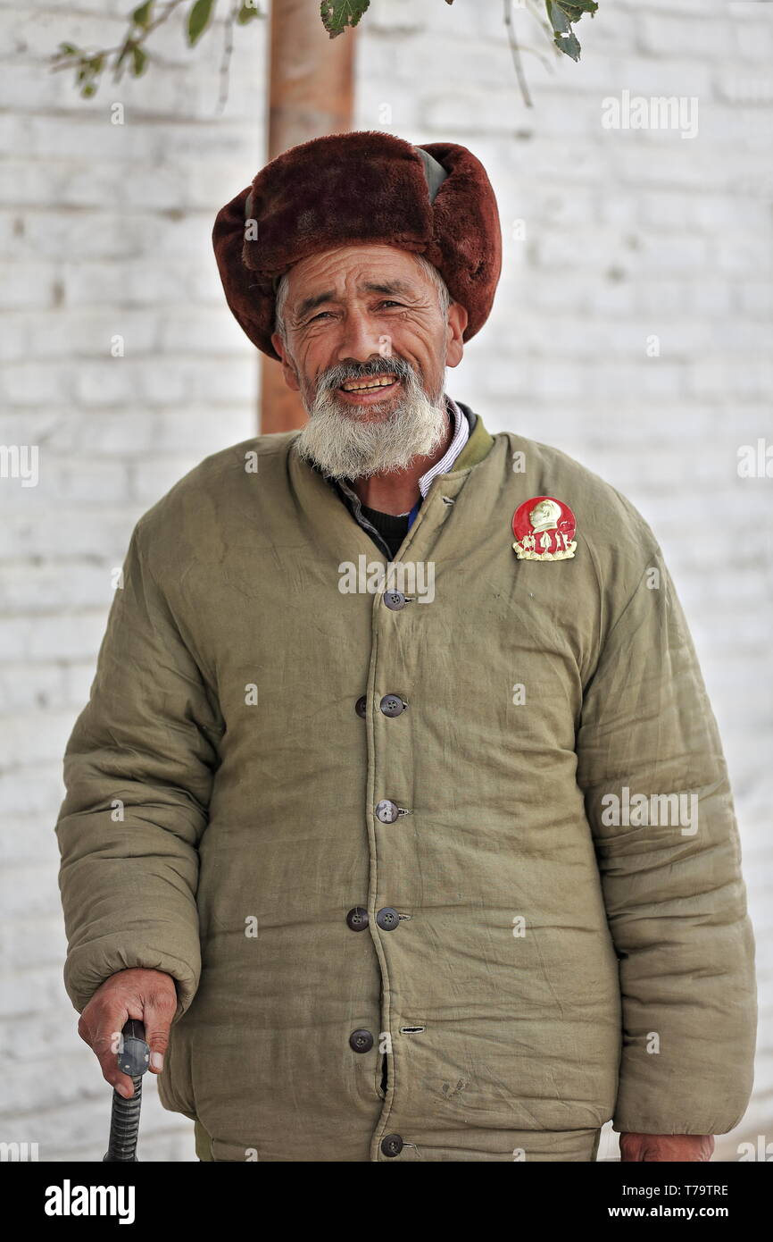 Uyghur old man with walking cane. Sunday Market rear area-Hotan-Xinjiang-China-0120 Stock Photo