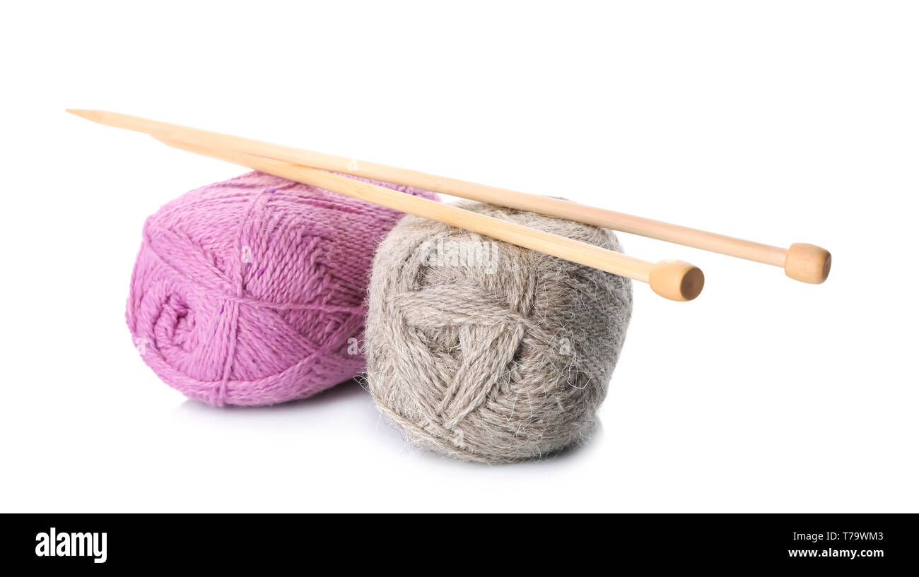 Color knitting yarn with needles on white background Stock Photo - Alamy