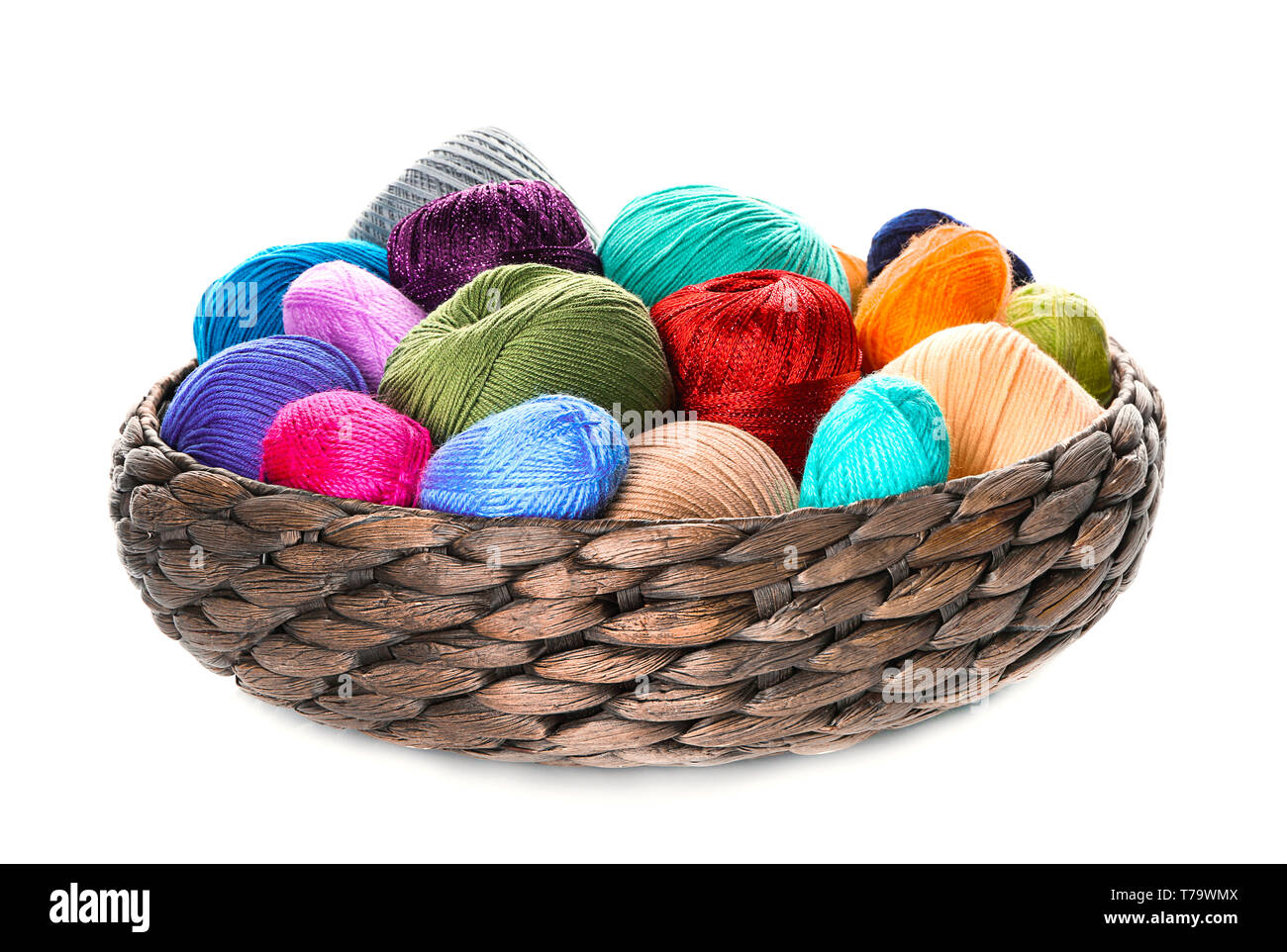 Wicker basket with knitting yarn on white background Stock Photo - Alamy