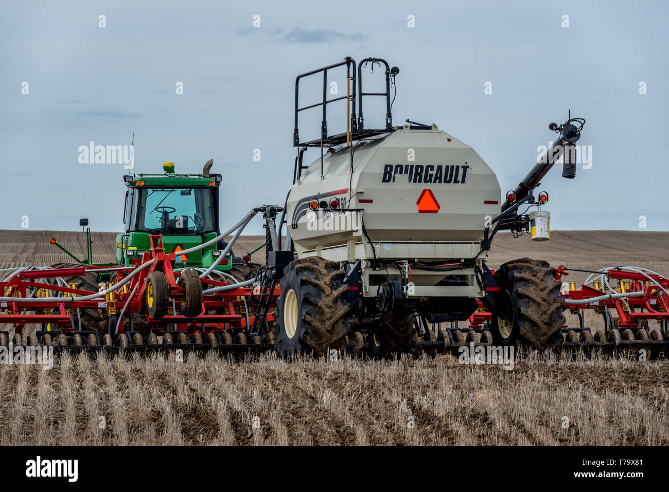 Swift Current, SK/Canada May 4, 2019 Tractor and air drill seeding
