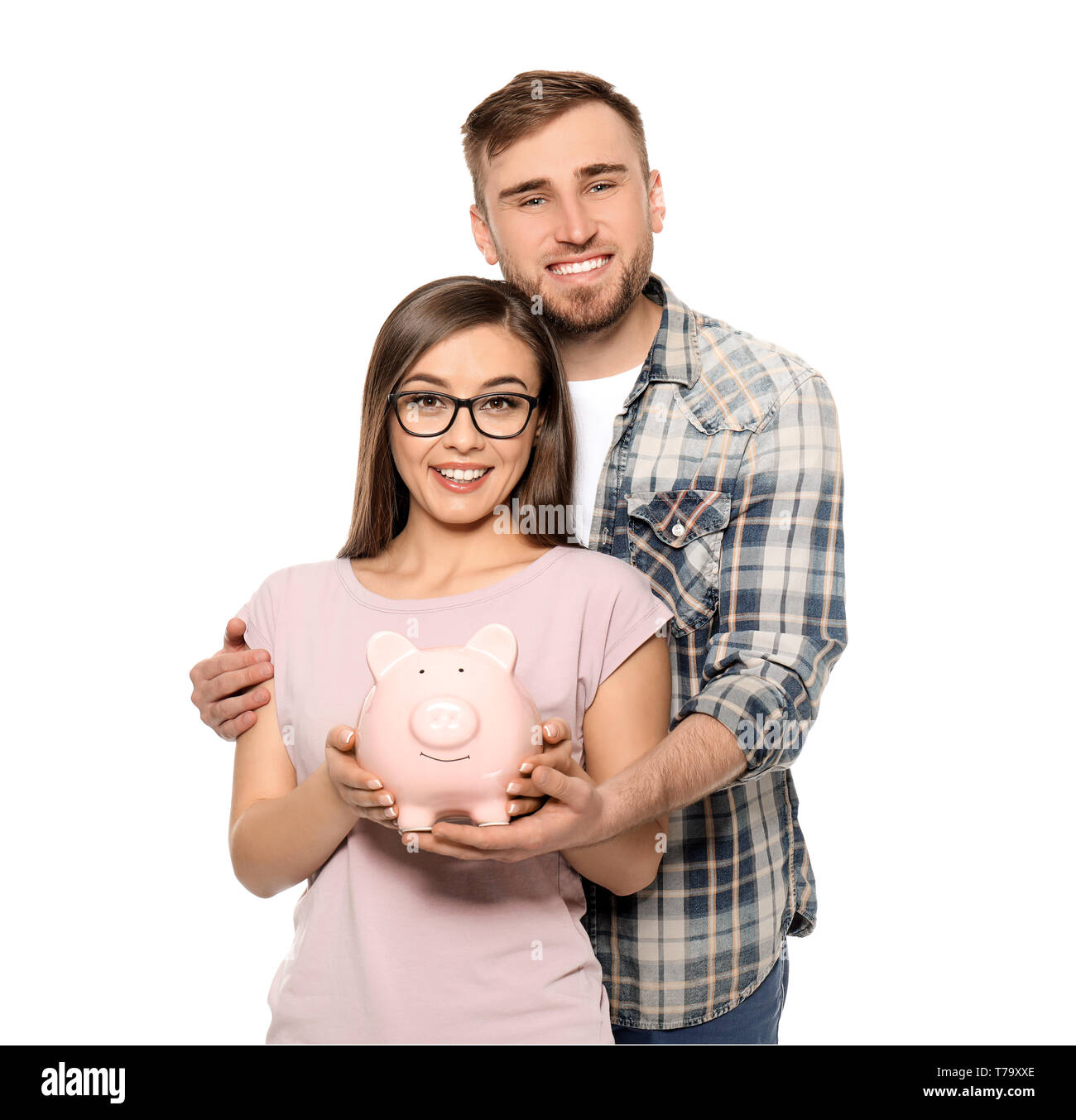 Happy couple holding piggy bank on white background. Money savings ...