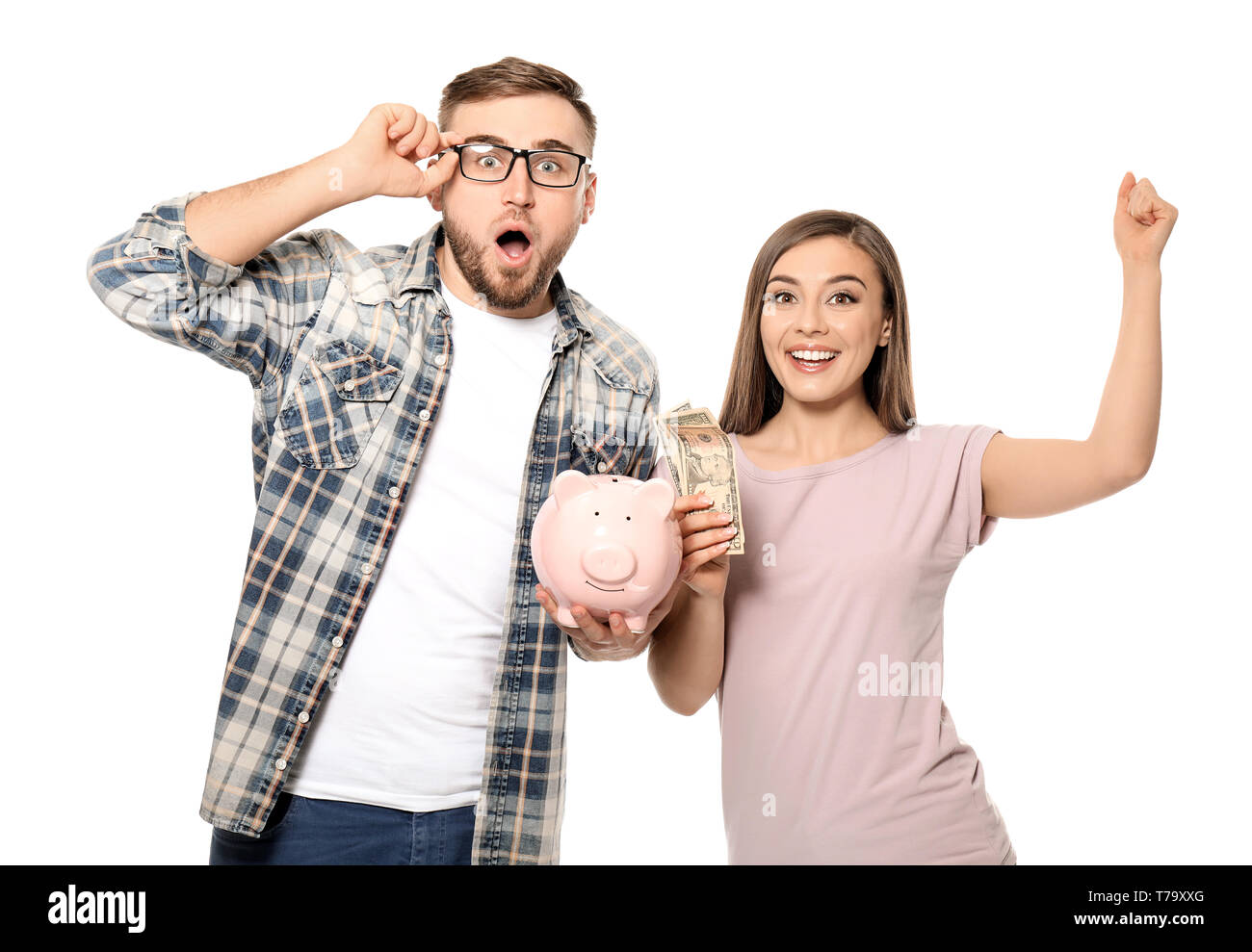 Emotional couple with piggy bank and dollar banknotes on white ...