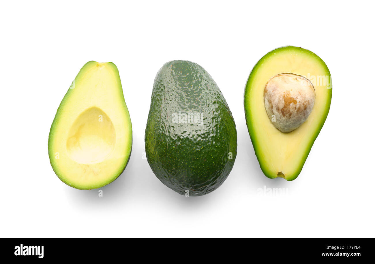 Fresh avocados on white background Stock Photo - Alamy
