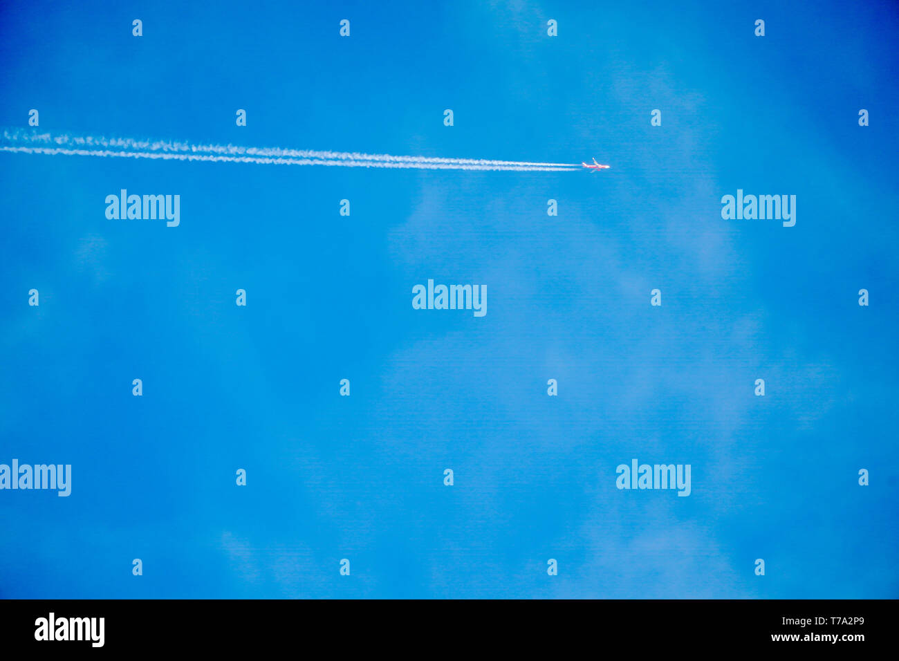 Clearly beautiful blue sky with white line plane Stock Photo - Alamy