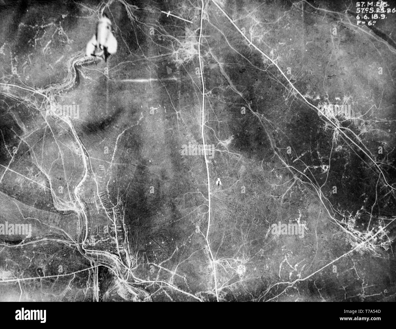 A remarkable black and white aerial British photograph taken on 6th June 1916 during  World War One, clearly showing two bombs being dropped from aeroplanes on to targets over Northern France. Stock Photo