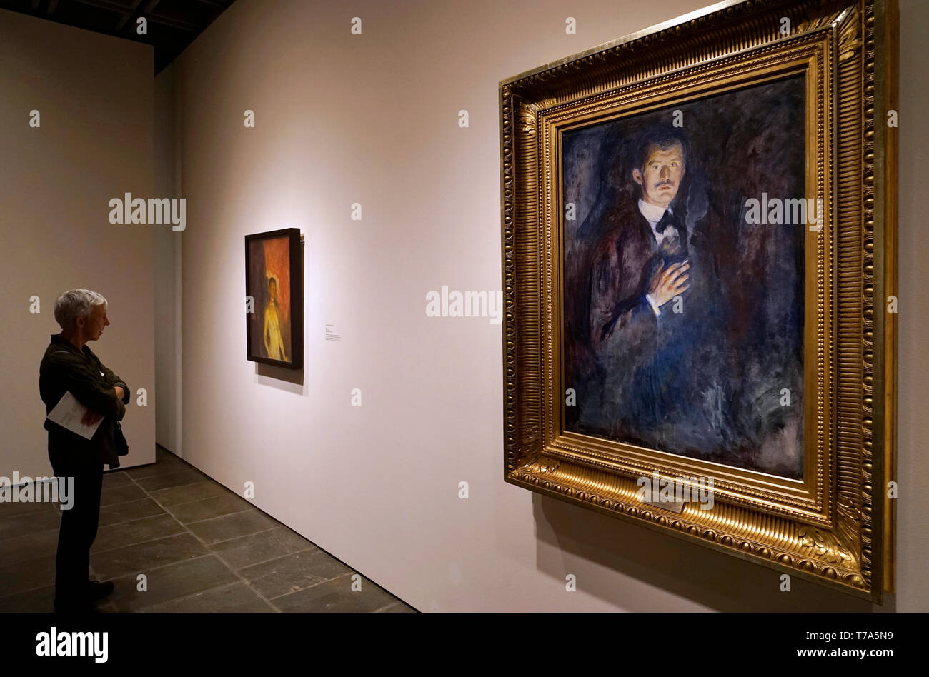 A visitor in front of Self-Portrait with cigarette (1895) by Edvard Munch in collection of Nasjonalmuseet for Kunst, Arkitektur og Design.Oslo.Norway Stock Photo