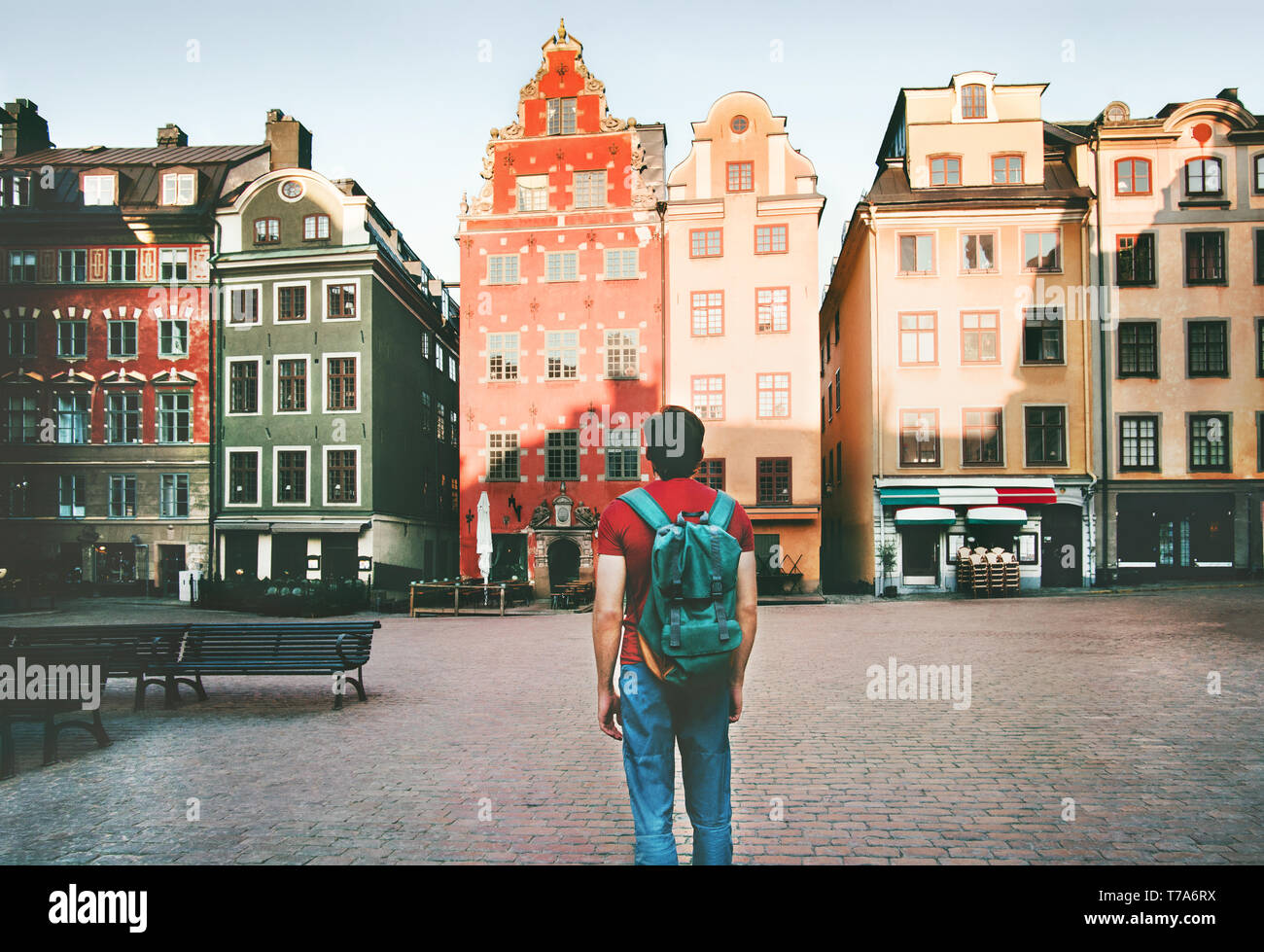 Man backpacker walking in Stockholm city travel sightseeing Stortorget  architecture lifestyle summer trip vacations in Sweden Stock Photo - Alamy