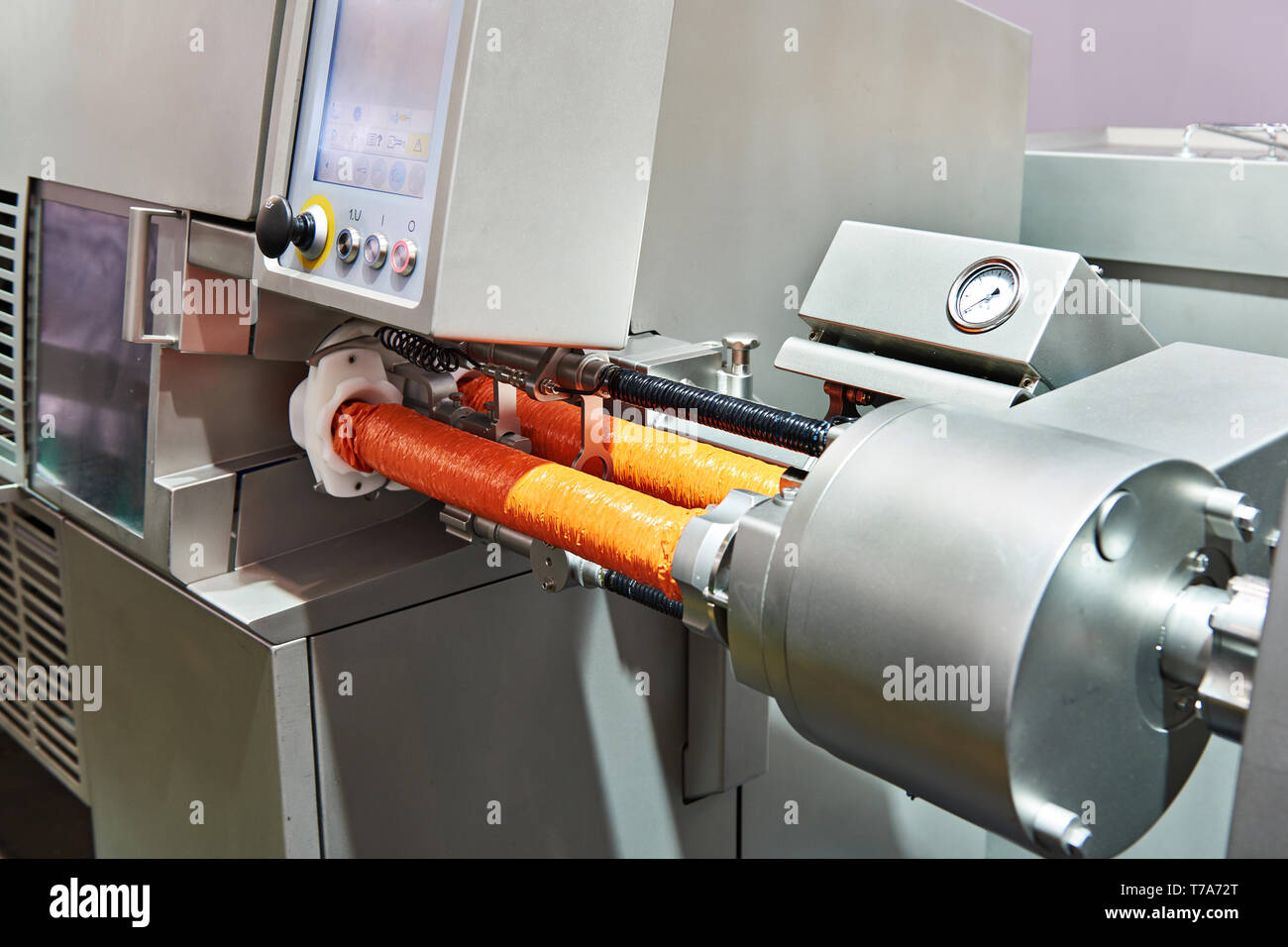 Automatic clipping hanging machine with pack for sausages Stock Photo