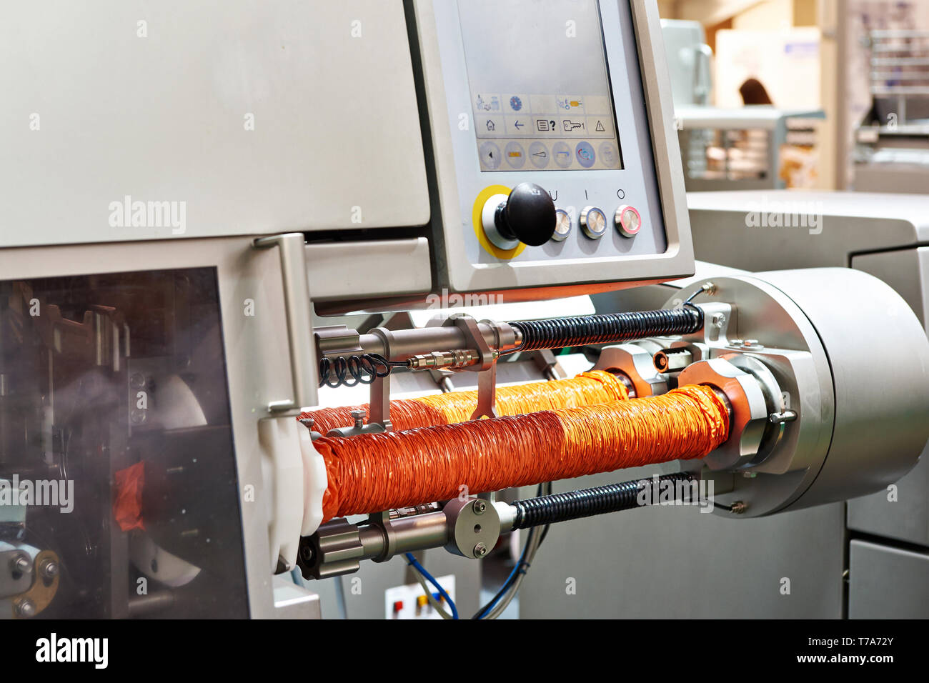 Automatic clipping hanging machine with pack for sausages Stock Photo