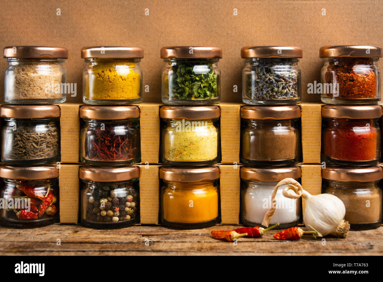 Large collection of spices in small jars on the shelf Stock Photo - Alamy