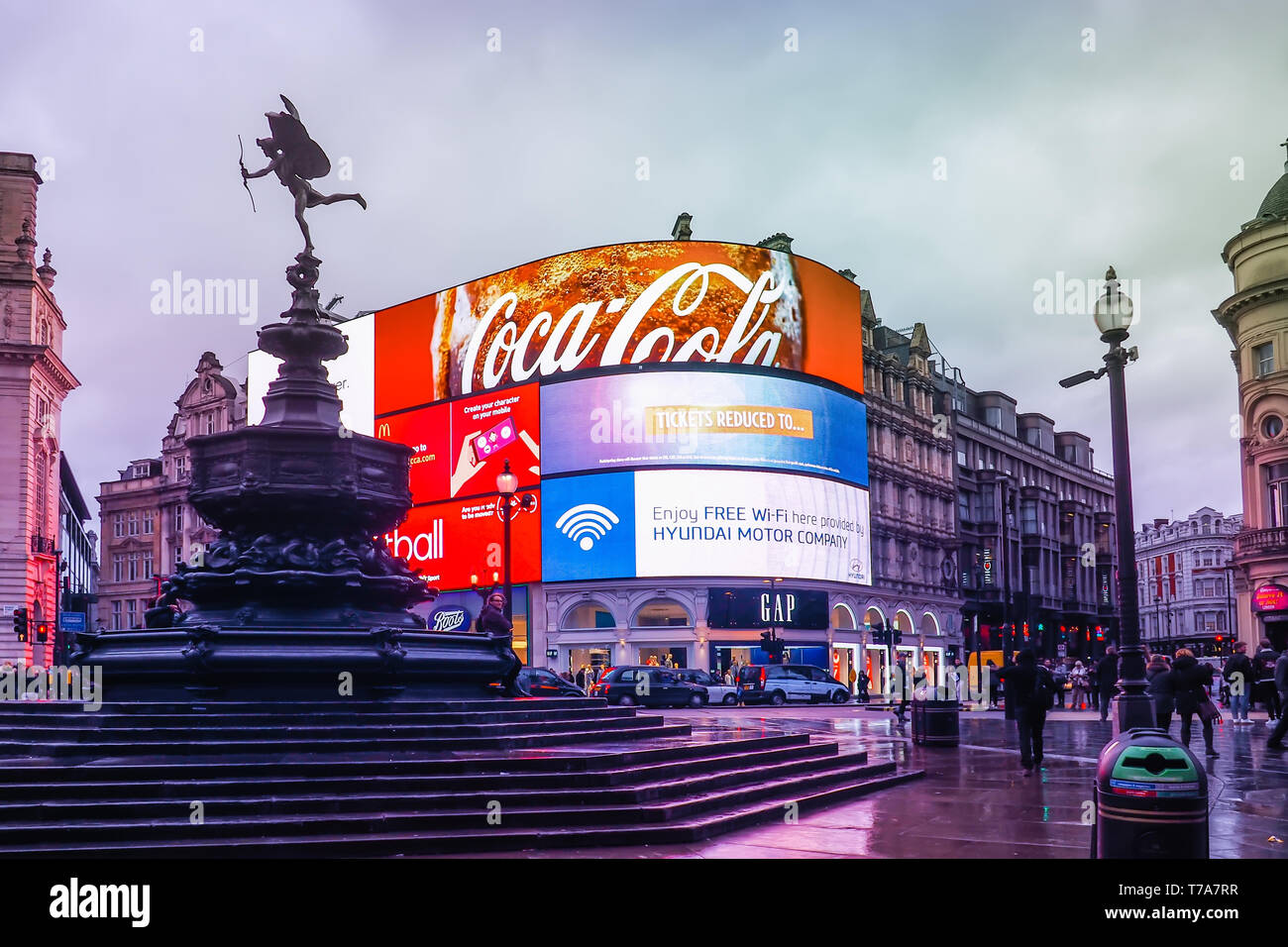 Piccadilly Circus with the Shaftesbury Memorial Fountain and advertising screens, a famous London landmark and busy destination for tourists. Stock Photo
