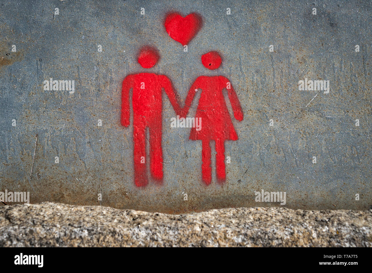 graffiti art of a couple with a heart, love concept Stock Photo - Alamy