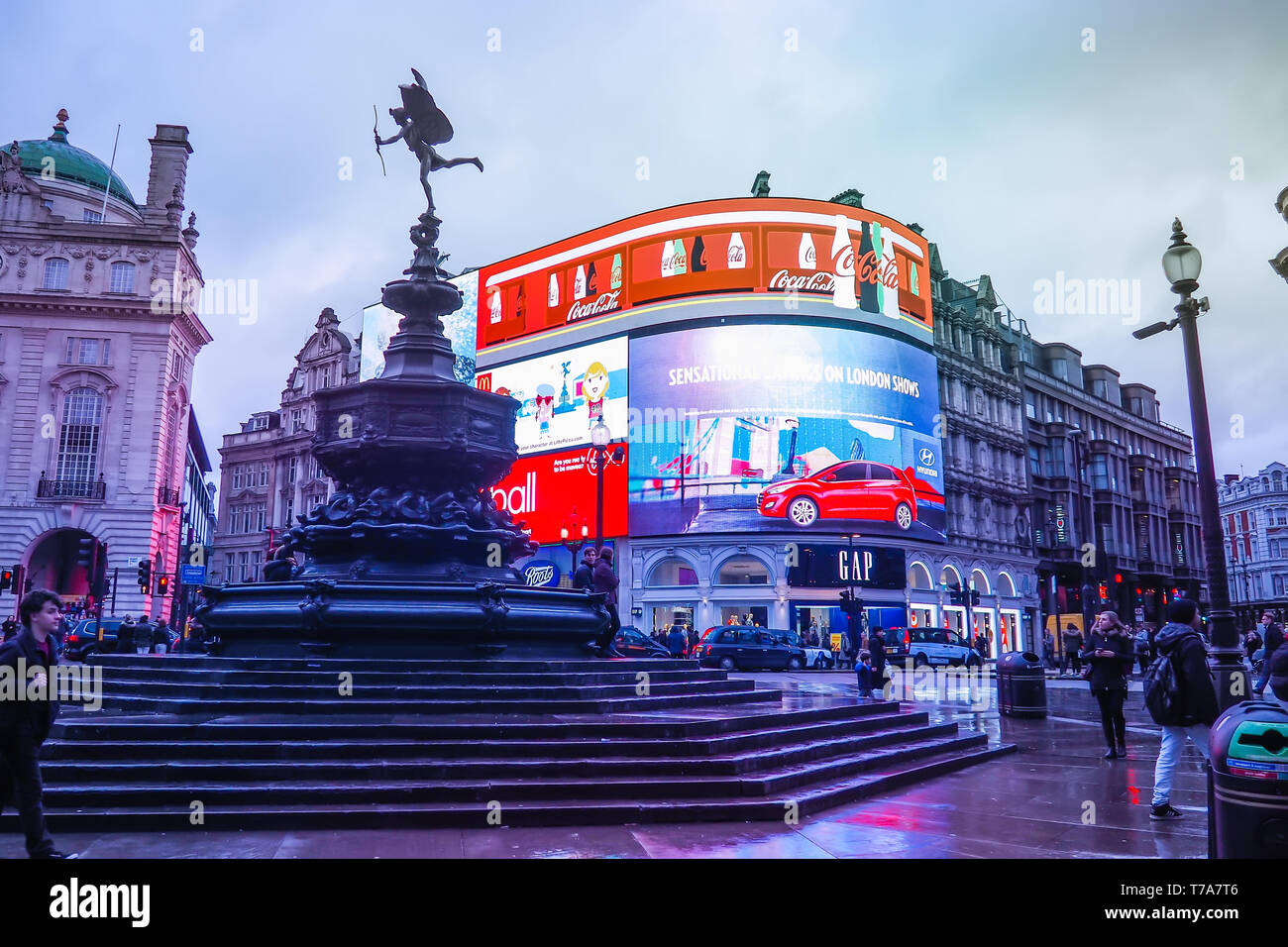 Piccadilly Circus with the Shaftesbury Memorial Fountain and advertising screens, a famous London landmark and busy destination for tourists. Stock Photo