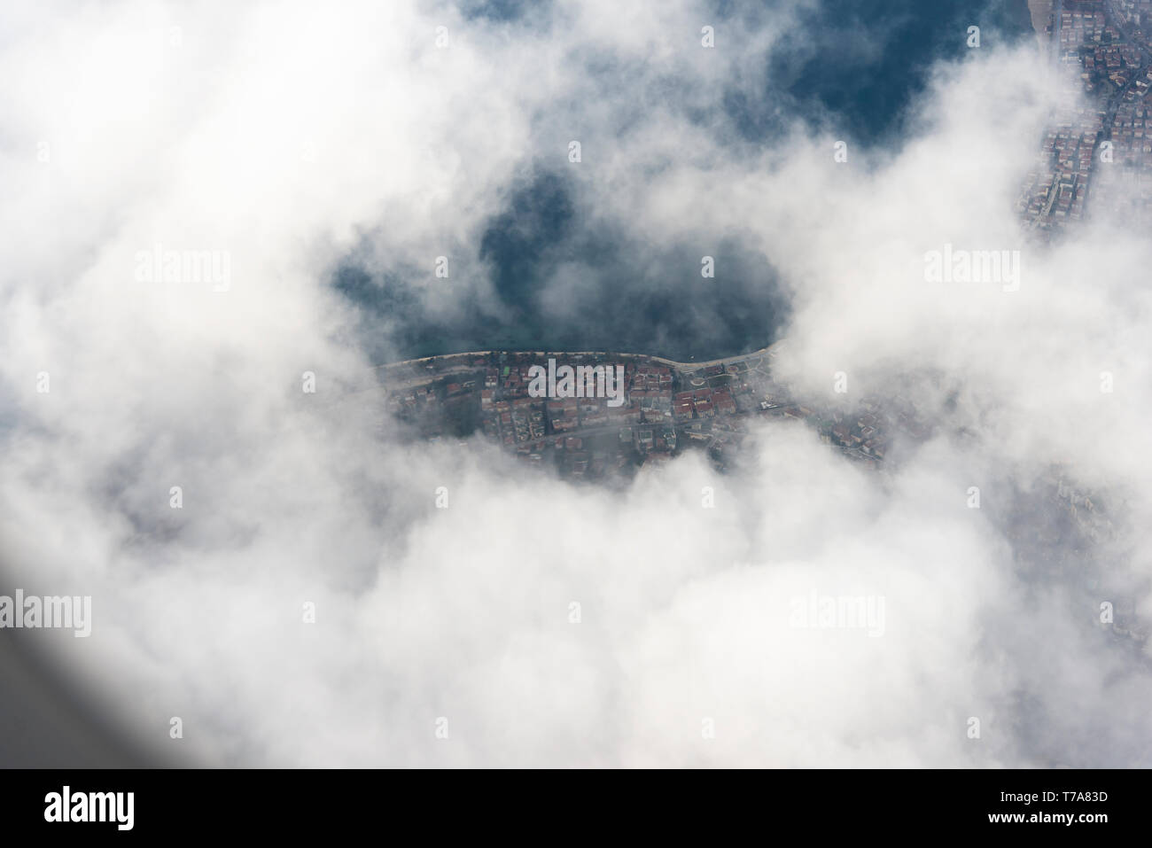 Some part of a City view above the clouds from a plane Stock Photo - Alamy