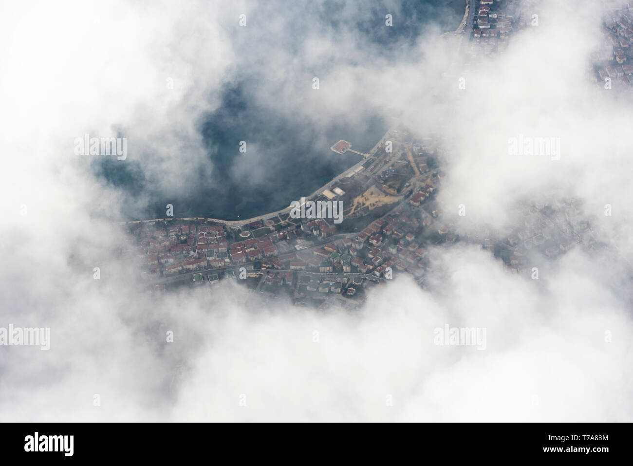 Some part of a City view above the clouds from a plane Stock Photo - Alamy