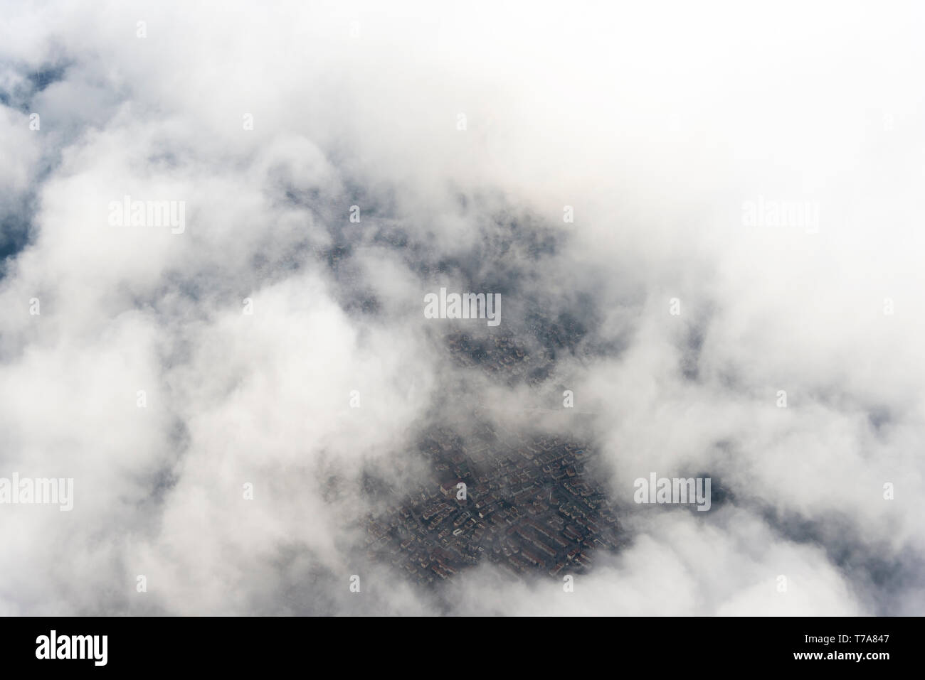 Some part of a City view above the clouds from a plane Stock Photo - Alamy
