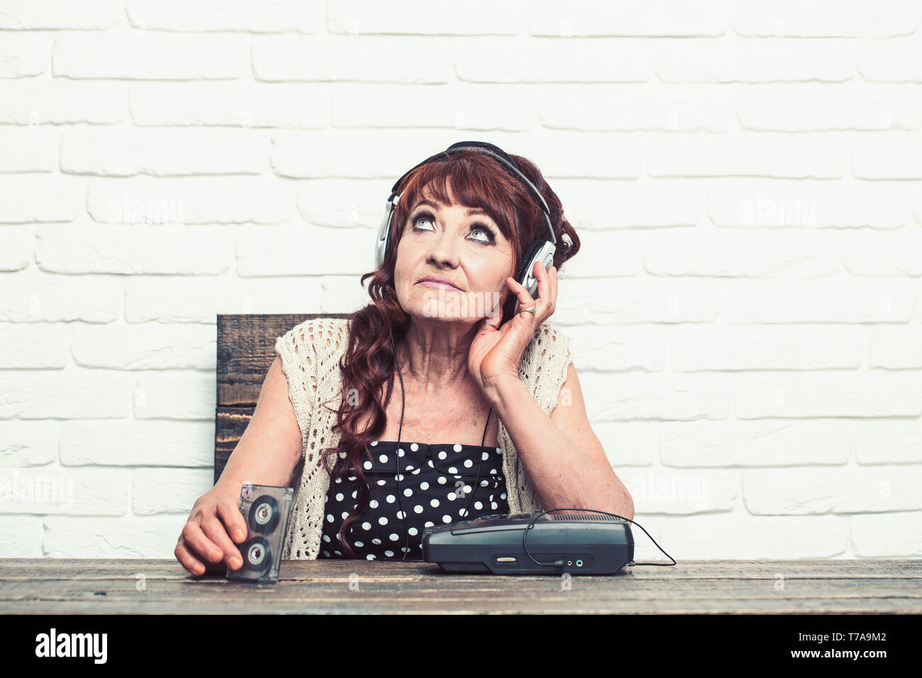 Granny dj in headset with cassette player Stock Photo - Alamy
