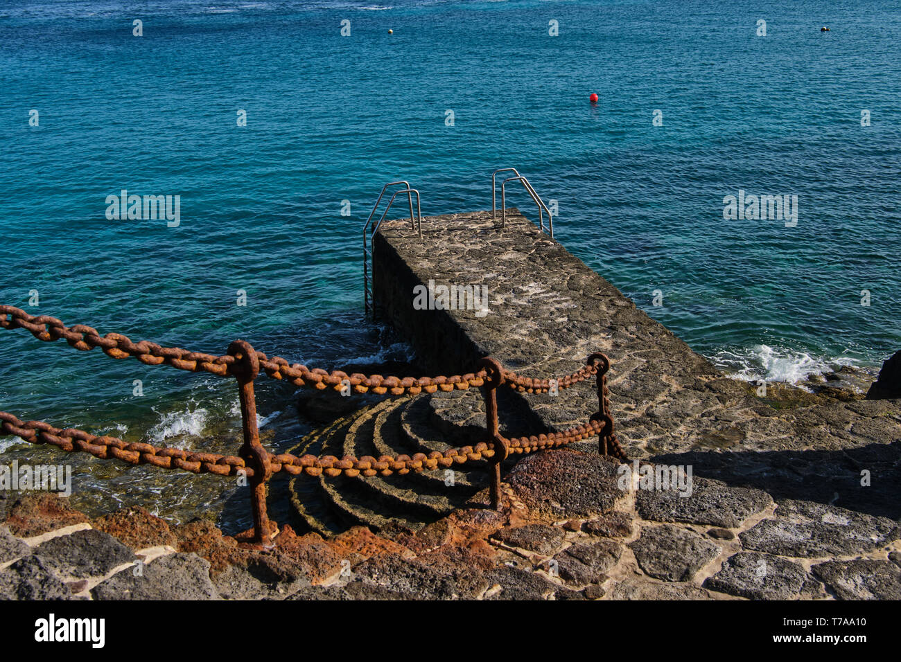 bathing jetty made out of volcanic rocks in Playa Blanca, Lanzarote Stock Photo